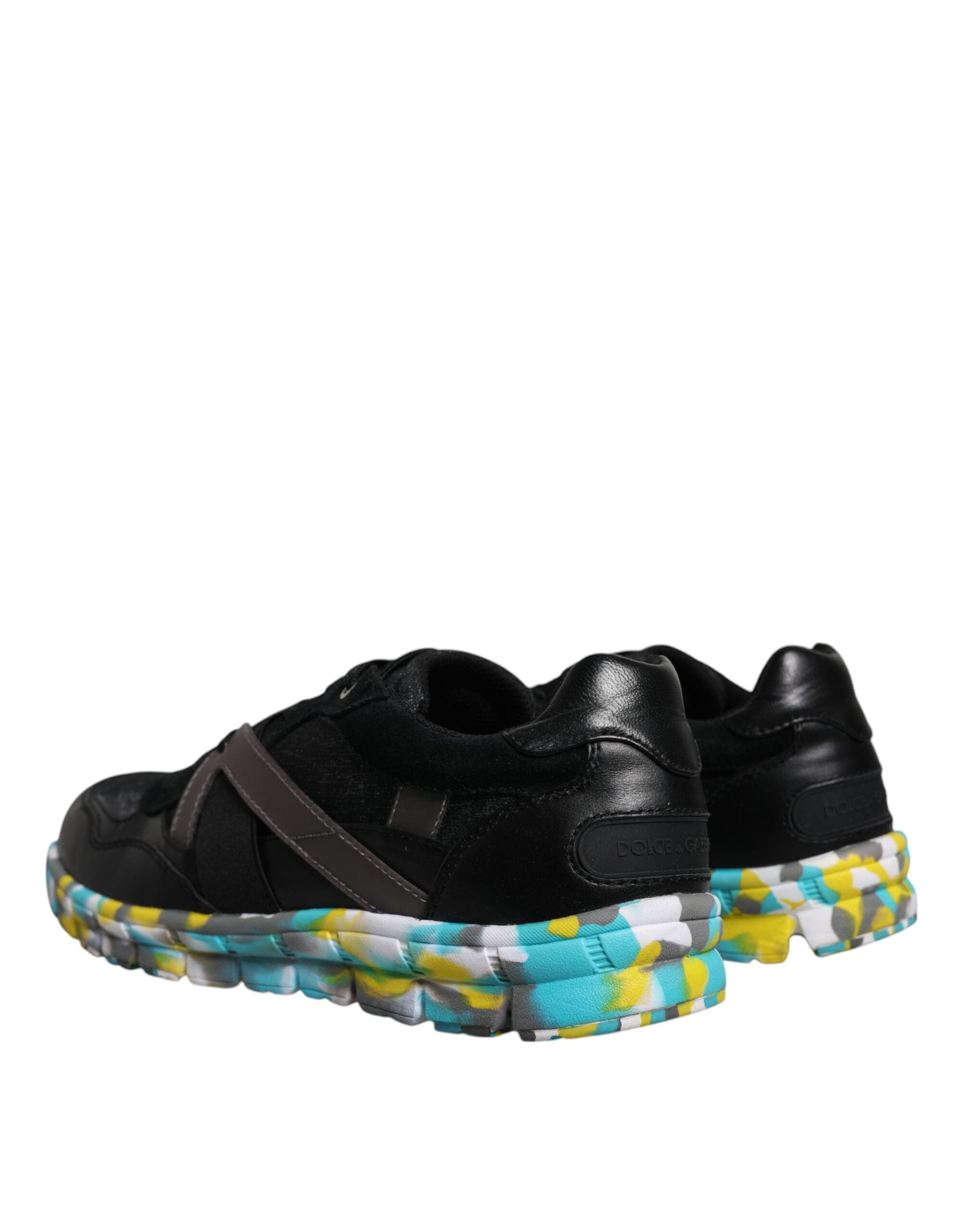 Elevate your style with Dolce & Gabbana's Black Polyester Low Top Sneakers, where exquisite craftsmanship meets luxurious materials for the discerning individual.