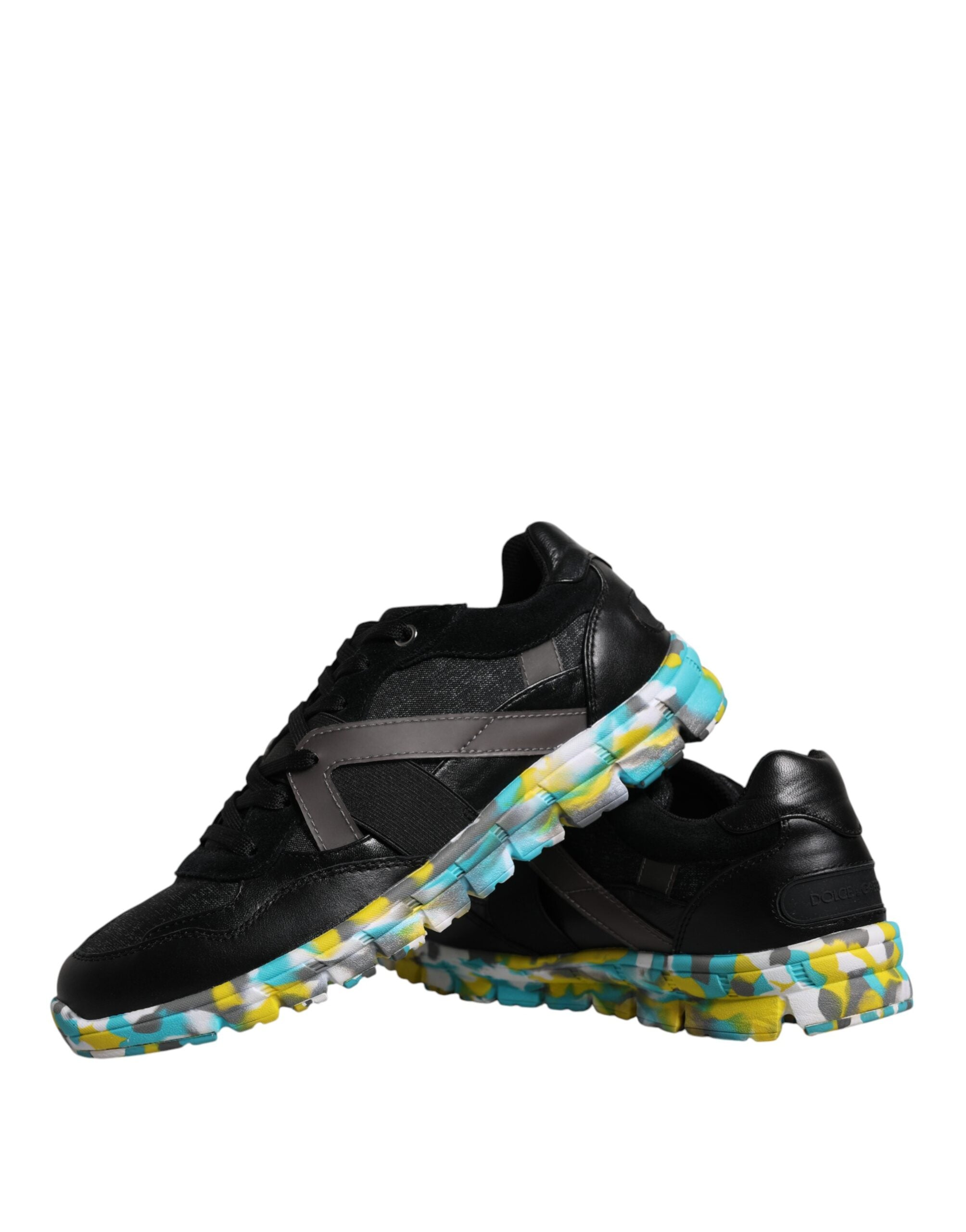 Elevate your style with Dolce & Gabbana's Black Polyester Low Top Sneakers, where exquisite craftsmanship meets luxurious materials for the discerning individual.