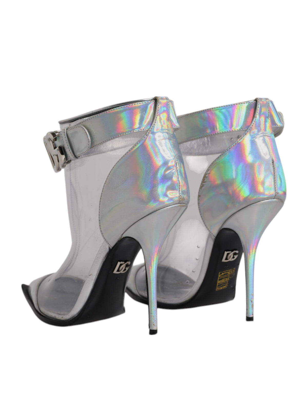 Step into luxury with Dolce & Gabbana's Silver Iridescent Pointed Short Boots, crafted in Italy from exquisite materials, embodying elegance and sophistication for every occasion.