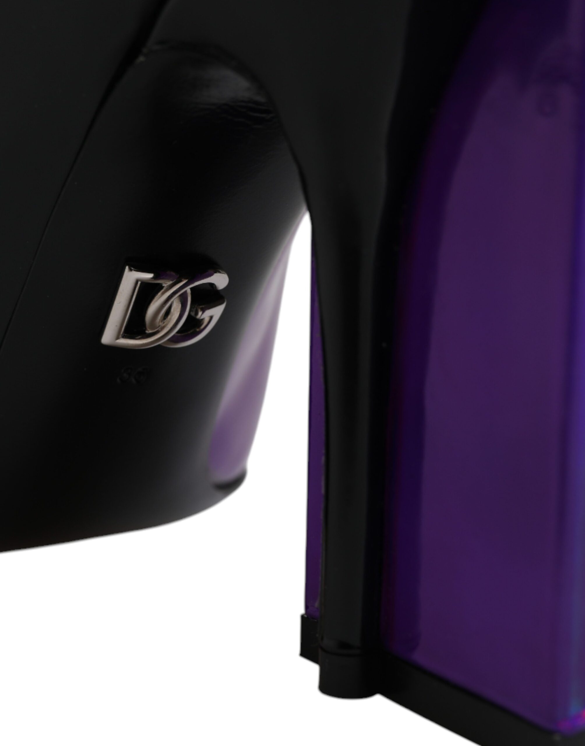 Elevate your style with Dolce & Gabbana's Purple Black Pointed Ankle Boots, crafted in Italy from exquisite leather, embodying luxury and contemporary elegance for the discerning.