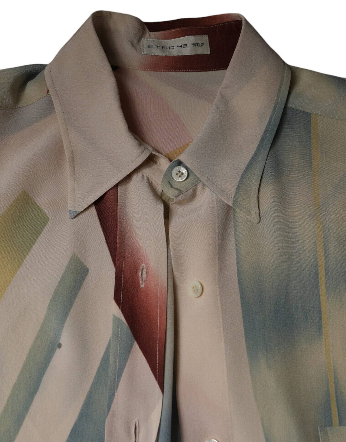 Indulge in the Etro Beige Printed Collared Blouse, a silk masterpiece reflecting Italian craftsmanship, perfect for elevating your wardrobe with timeless elegance.