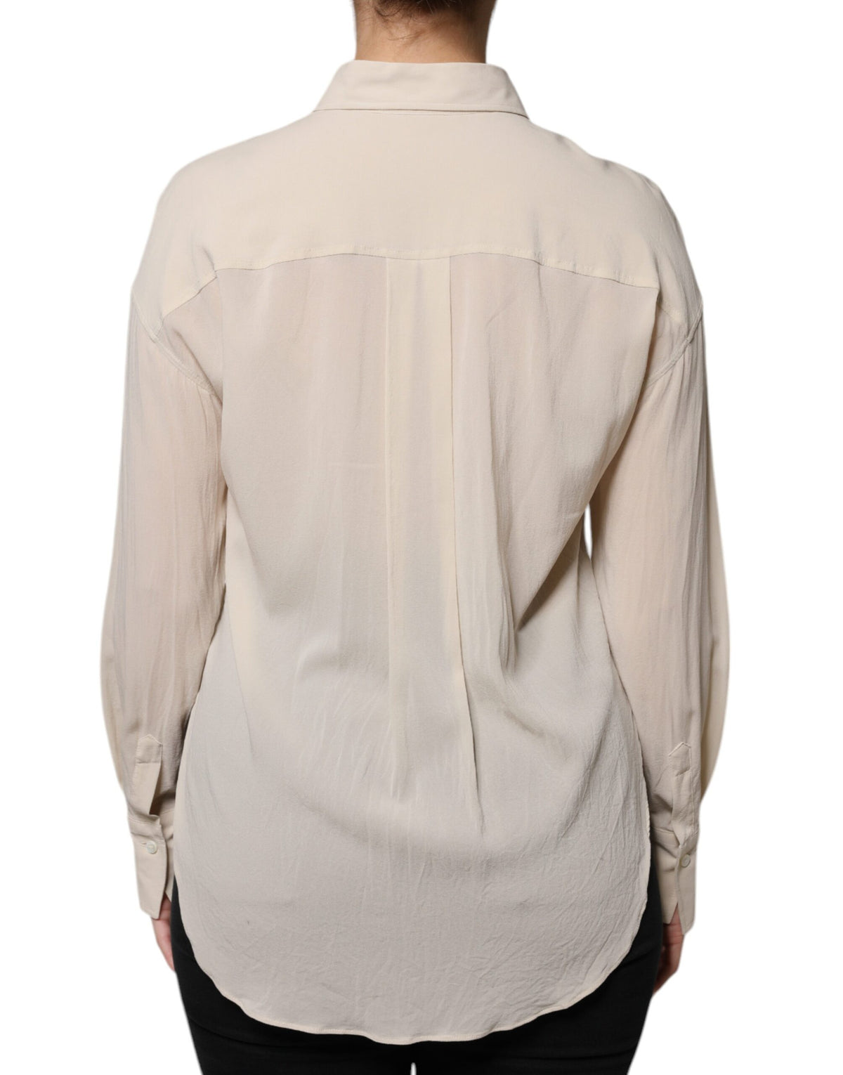 Indulge in the exquisite Brunello Cucinelli Beige Silk Blend Collared Button Down Top, a timeless masterpiece of luxury and elegance, crafted for the discerning individual.