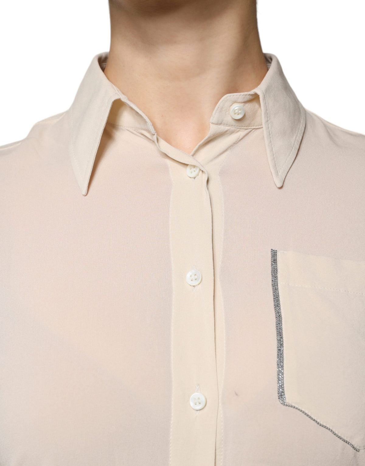 Indulge in the exquisite Brunello Cucinelli Beige Silk Blend Collared Button Down Top, a timeless piece that embodies luxury and sophistication for the discerning individual.