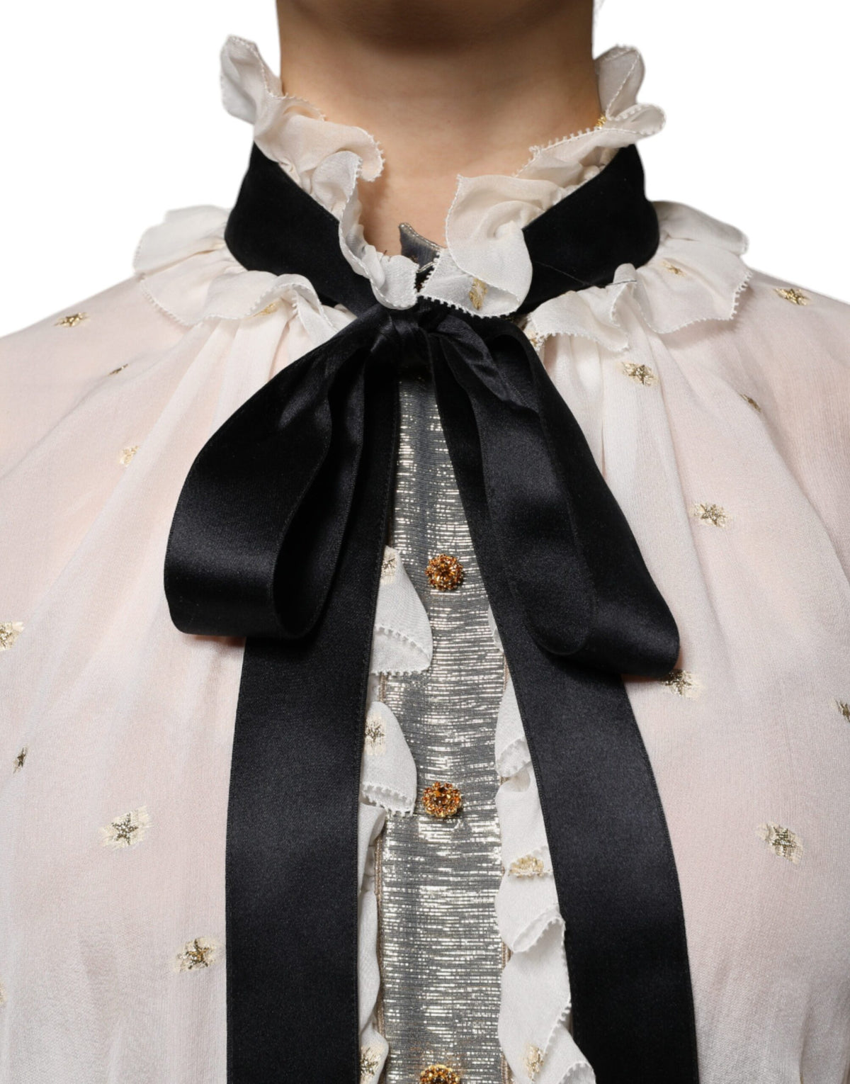 Indulge in the exquisite Dolce & Gabbana Off White Silk Blend Ascot Collar Blouse, a timeless piece that embodies refined elegance and sophisticated allure.