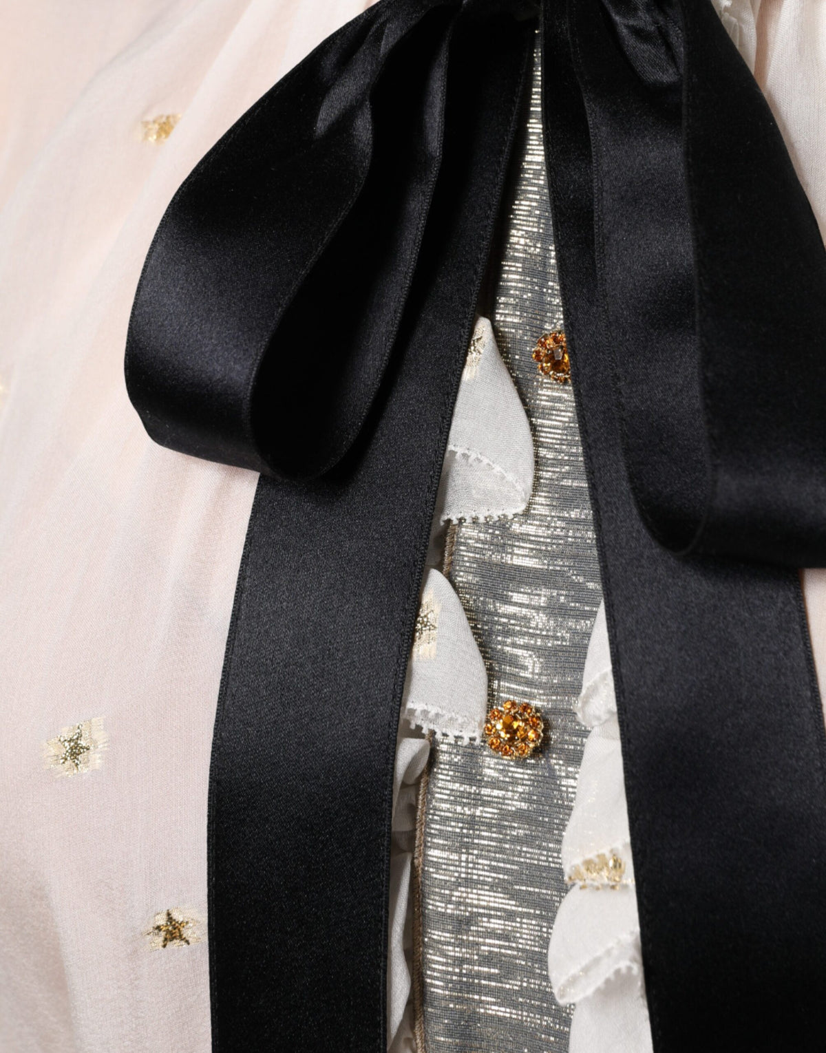 Elevate your elegance with the Dolce & Gabbana Off White Silk Blend Ascot Collar Blouse, a timeless masterpiece of luxury and sophistication, crafted for the discerning individual.