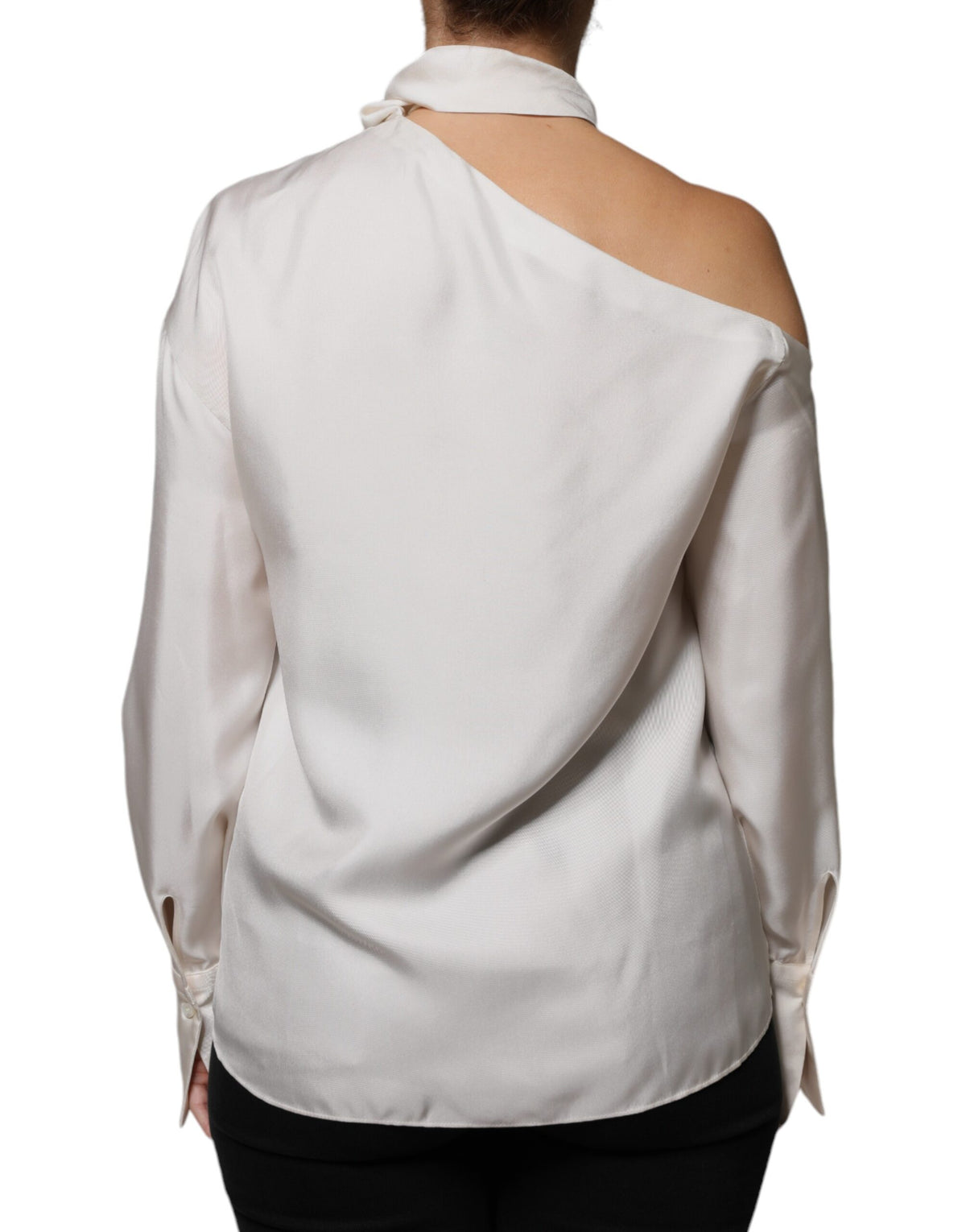 Discover the Brunello Cucinelli Beige Silk Ascot Collared Long Sleeves Top, a masterpiece of exquisite craftsmanship and timeless elegance, perfect for the discerning individual.