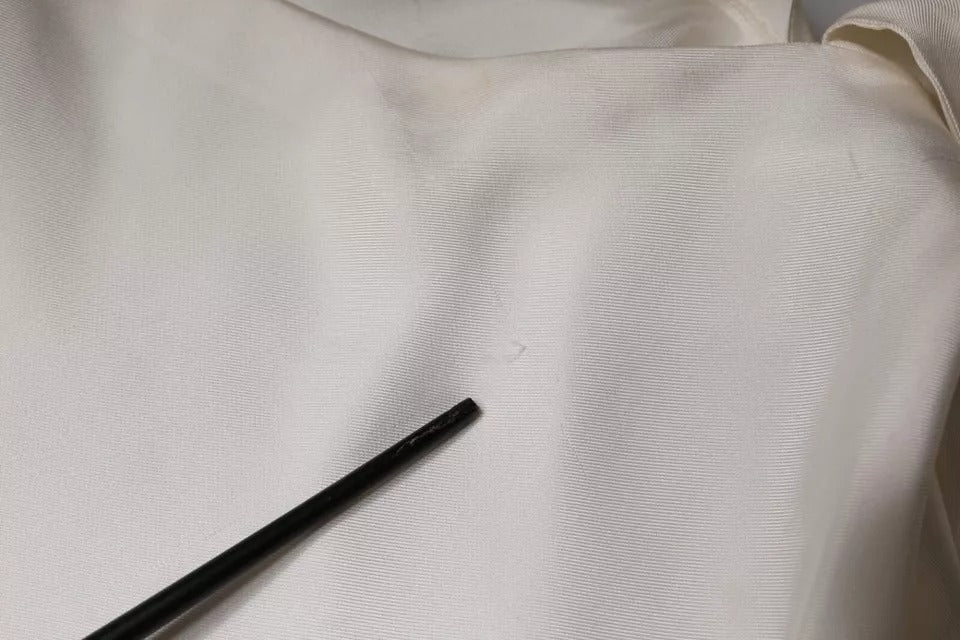 Discover the exquisite Brunello Cucinelli Beige Silk Ascot Collared Long Sleeves Top, where luxurious silk and impeccable craftsmanship redefine elegance for the discerning individual.