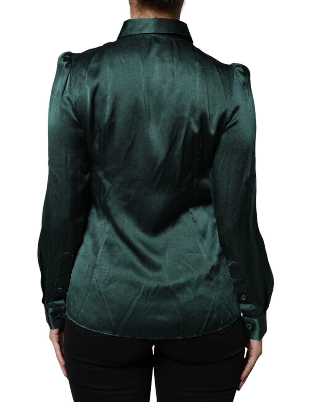 Indulge in the exquisite elegance of the Dolce & Gabbana Dark Green Silk Button Down Blouse, a timeless piece that embodies luxurious craftsmanship and sophisticated allure.