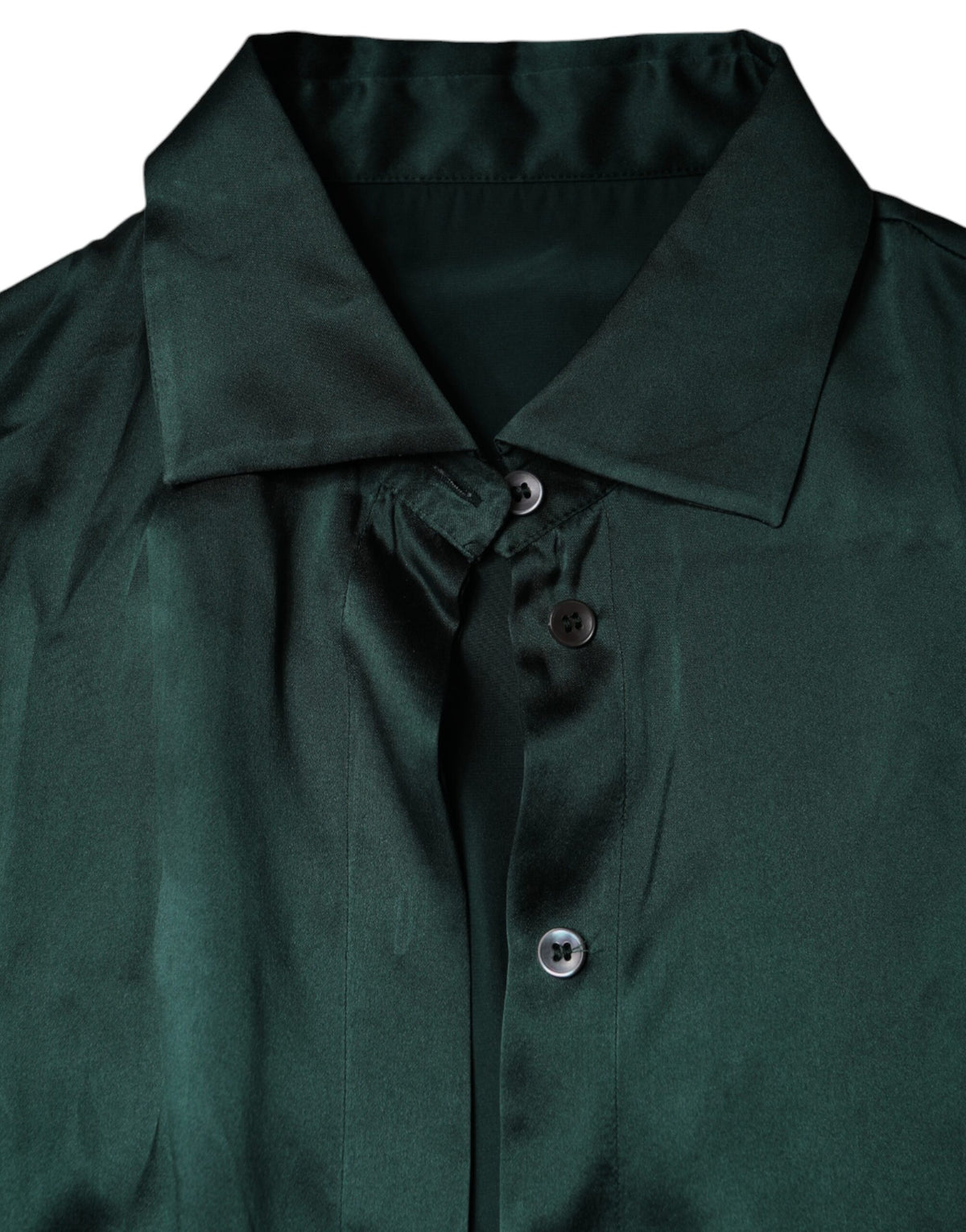 Discover the Dolce & Gabbana Dark Green Silk Button Down Blouse, a masterpiece of exquisite craftsmanship and timeless elegance, perfect for embodying refined sophistication.