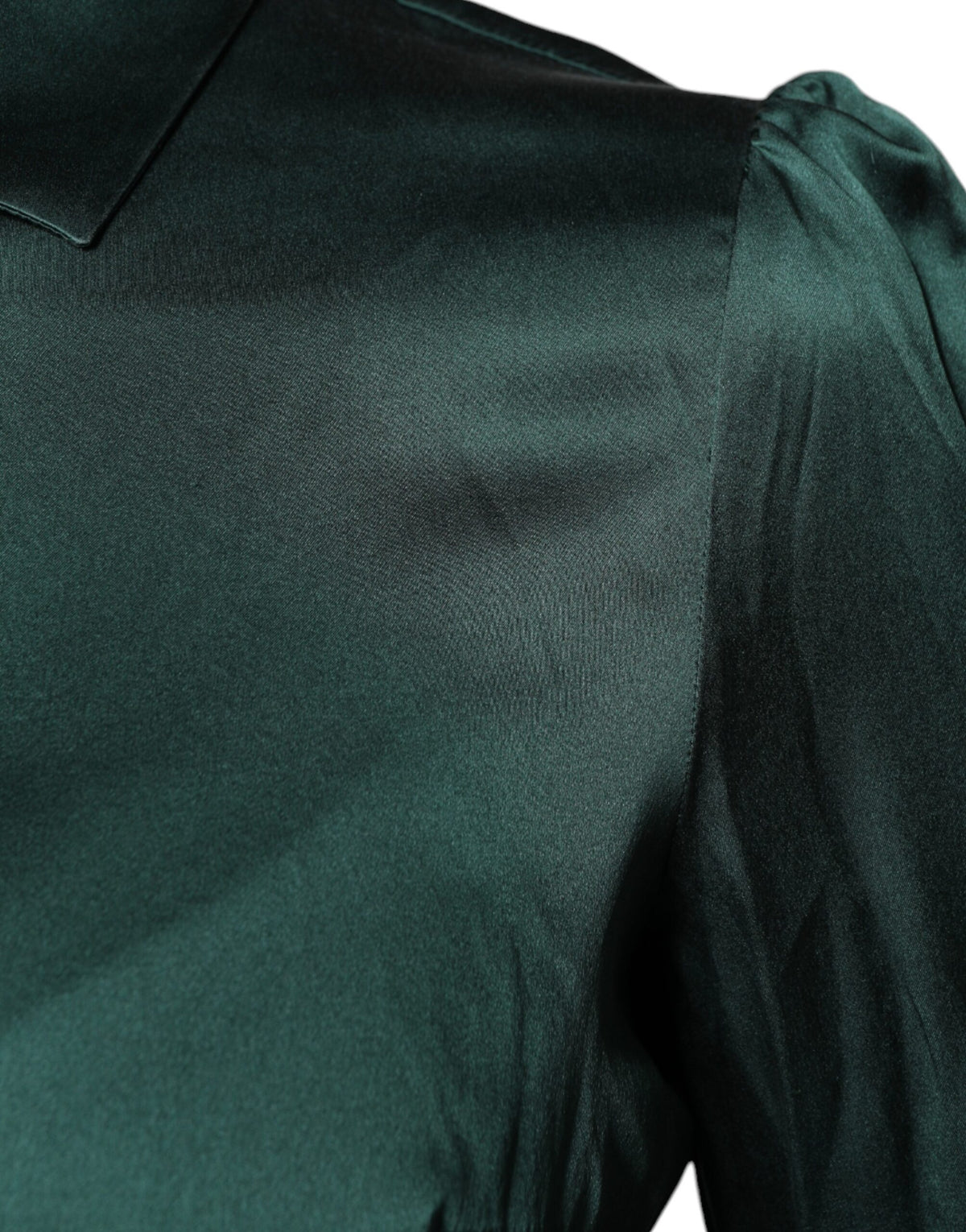 Indulge in the exquisite elegance of the Dolce & Gabbana Dark Green Silk Button Down Blouse, a timeless masterpiece that embodies luxurious craftsmanship and refined sophistication.