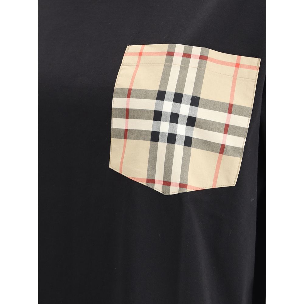 Elevate your wardrobe with the Burberry Black Cotton T-Shirt, a luxurious blend of comfort and style featuring an Archive Check pocket, perfect for the discerning individual.