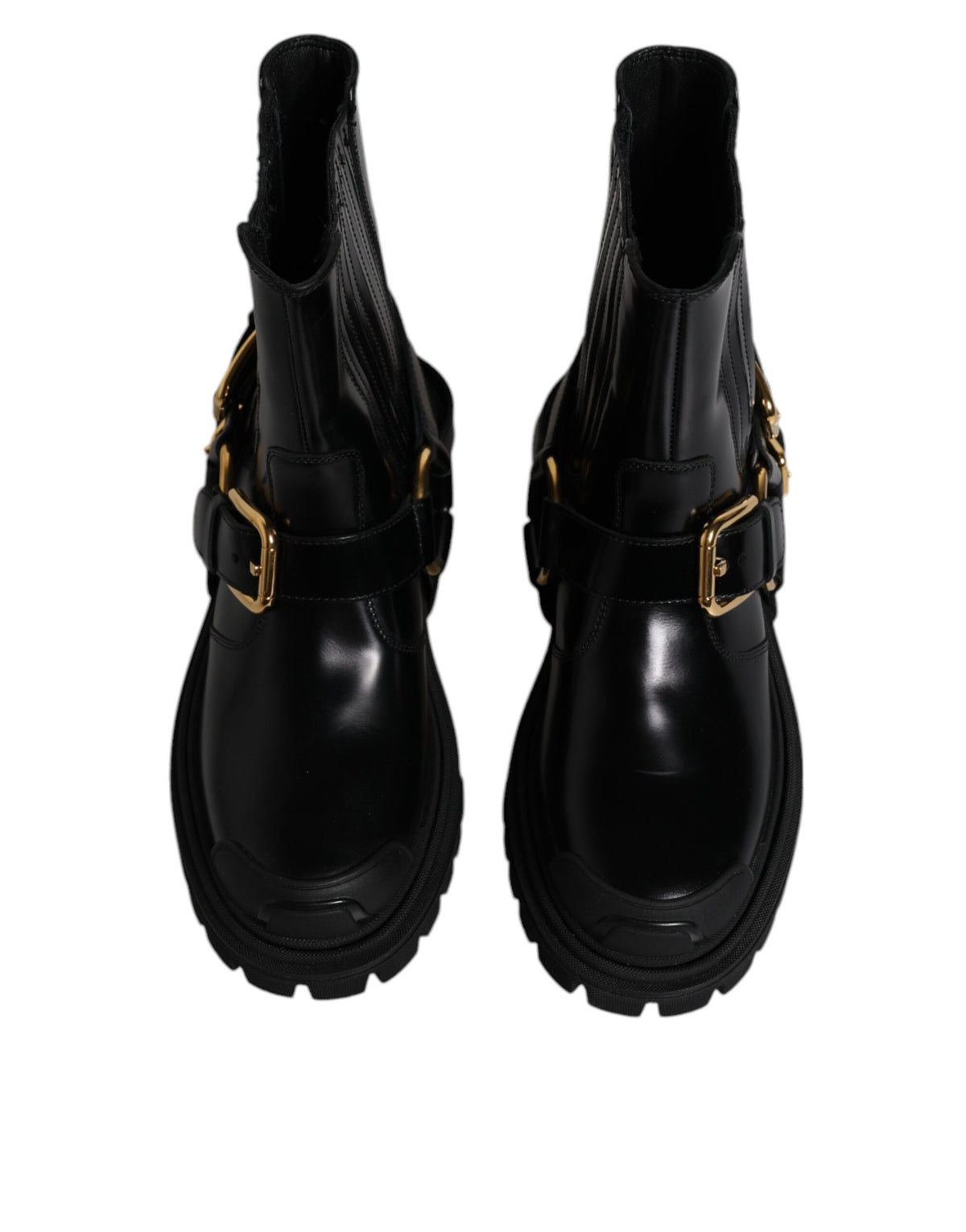 Step into luxury with Dolce & Gabbana's Black Leather Slip On Stretch Trekking Boots, handcrafted in Italy, blending elegance and adventure for the discerning individual.