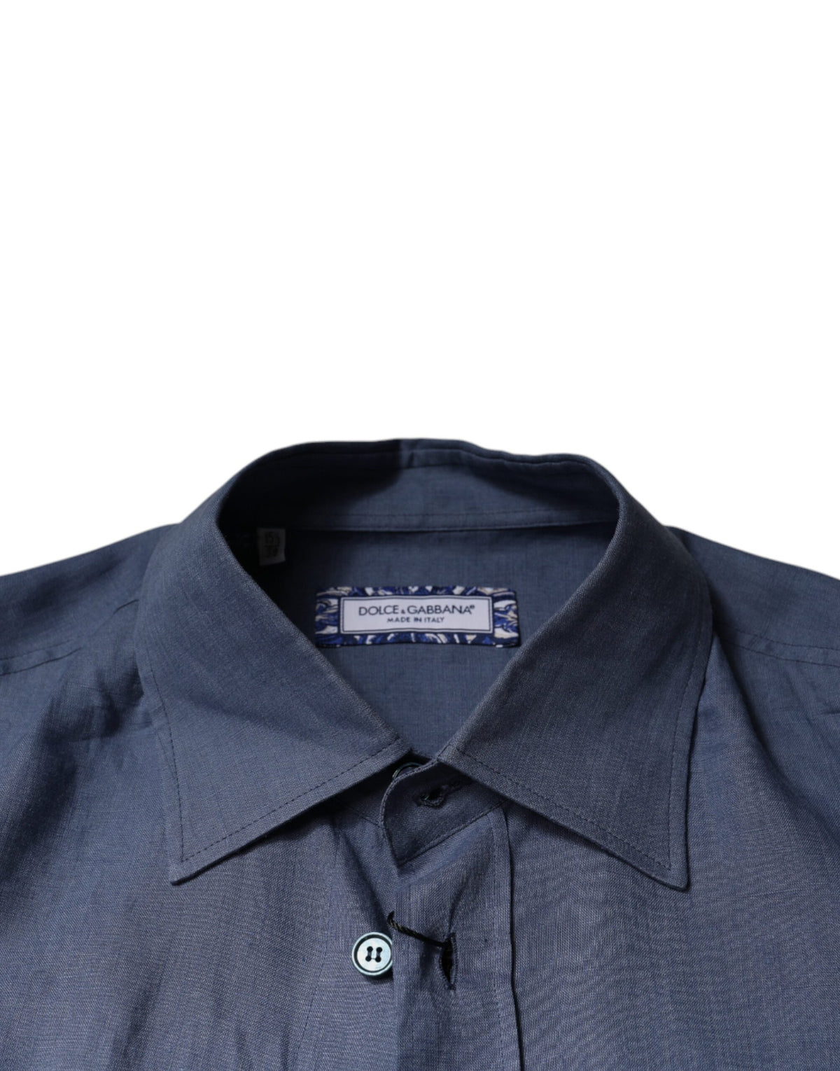 Indulge in the Dolce & Gabbana Blue Logo Long Sleeve Button Down Shirt, crafted from 100% flax, embodying timeless elegance and luxurious sophistication for the discerning individual.
