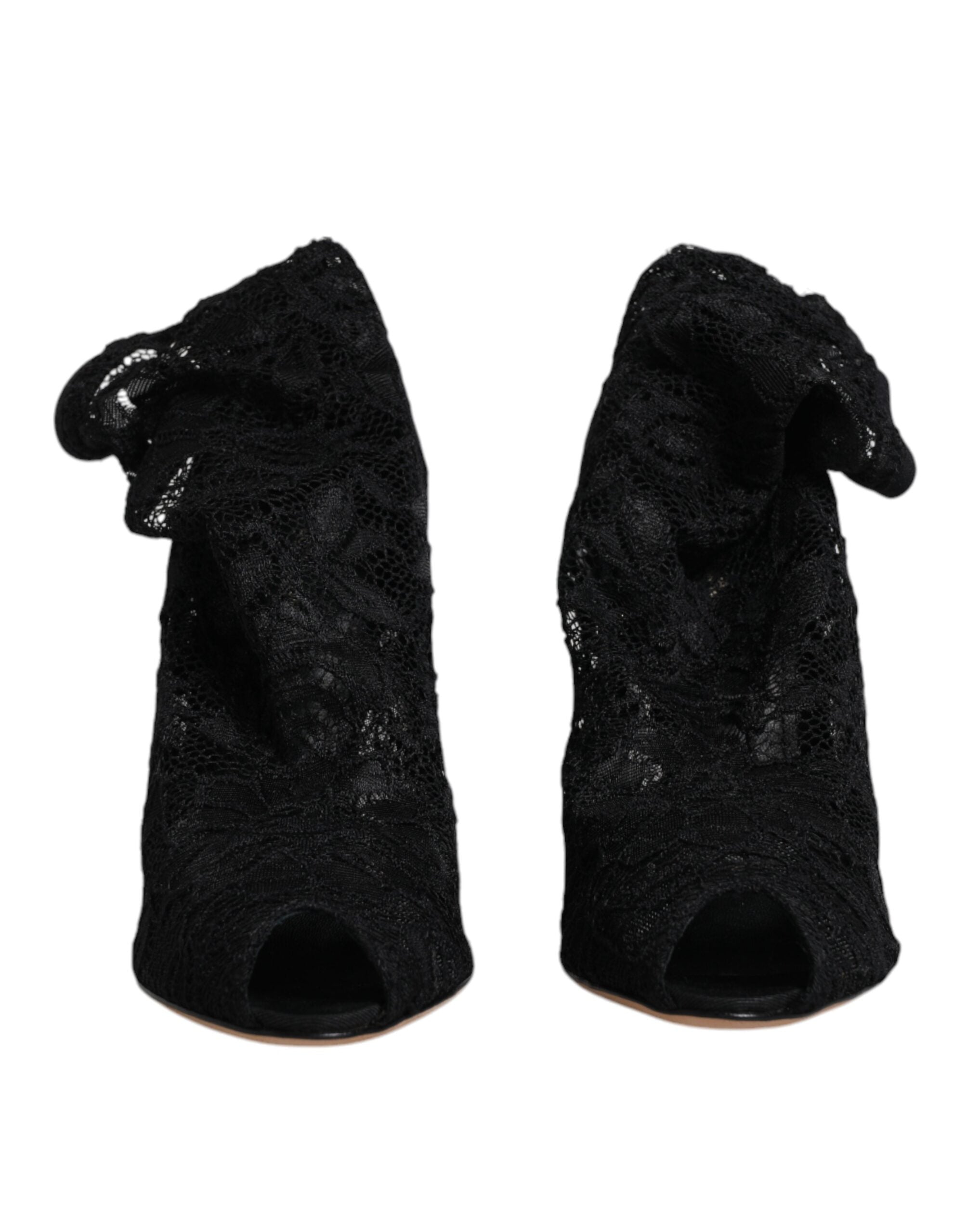 Step into a world of opulence with Dolce & Gabbana's Black Lace Stretch Heels, where exquisite Italian craftsmanship meets timeless elegance for the discerning individual.