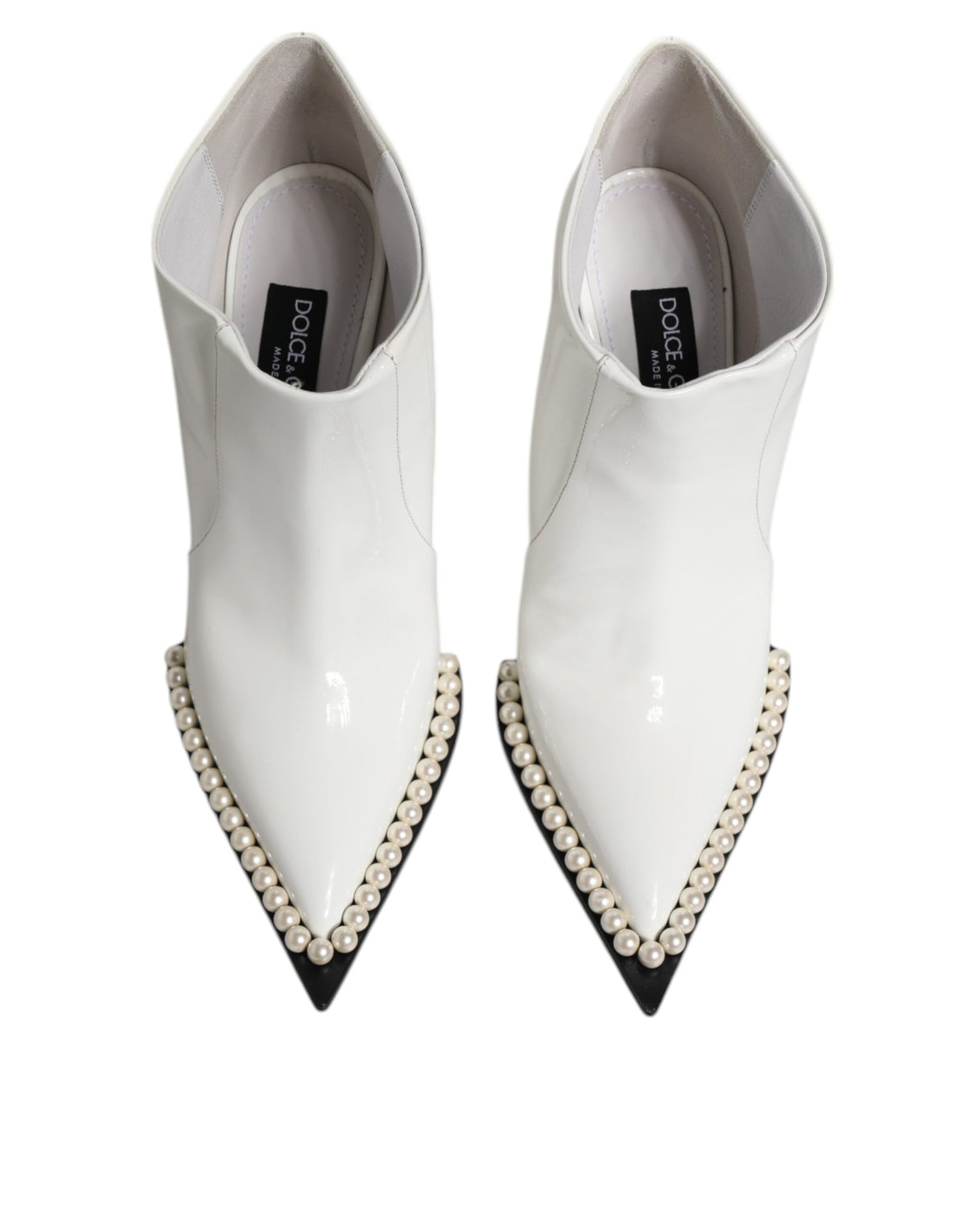 Step into sophistication with Dolce & Gabbana's White Faux Pearl Leather Ankle Boots, crafted from premium calf leather, embodying timeless elegance for the discerning individual.