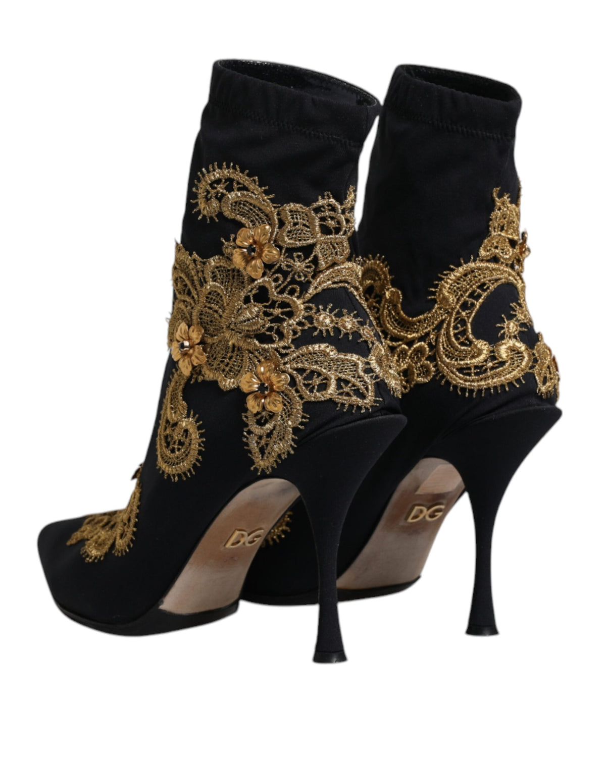 Elevate your style with Dolce & Gabbana's Black Gold Embroidery Slip On Boots, where Italian craftsmanship meets luxurious comfort for the discerning fashion connoisseur.