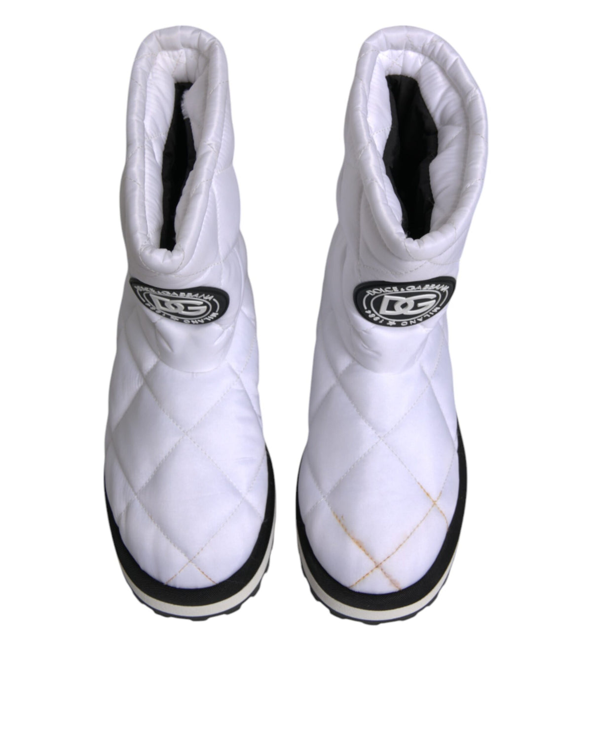 Indulge in the exquisite Dolce & Gabbana White Viscose Padded Mid Calf Boots, where Italian craftsmanship meets modern elegance, perfect for the discerning individual.