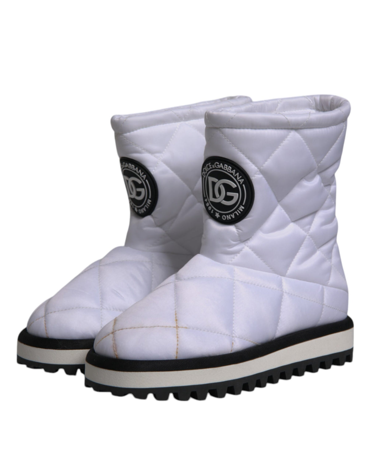 Indulge in the exquisite Dolce & Gabbana White Viscose Padded Mid Calf Boots, where Italian craftsmanship meets luxurious comfort, perfect for the modern connoisseur.