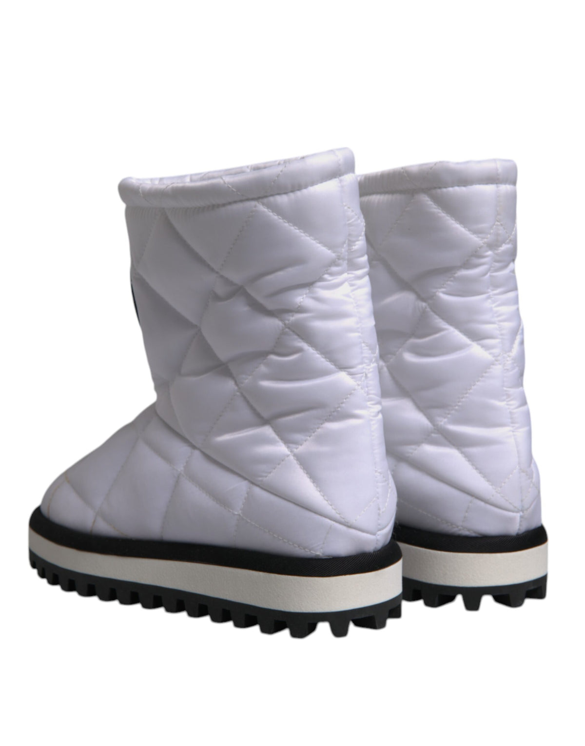 Elevate your style with Dolce & Gabbana's White Viscose Padded Mid Calf Boots, a testament to Italian craftsmanship and luxurious comfort, perfect for any sophisticated occasion.