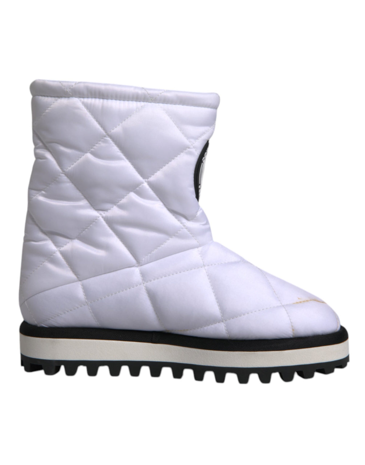 Indulge in the exquisite craftsmanship of Dolce & Gabbana's White Viscose Padded Mid Calf Boots, where luxurious materials meet modern elegance for the discerning individual.