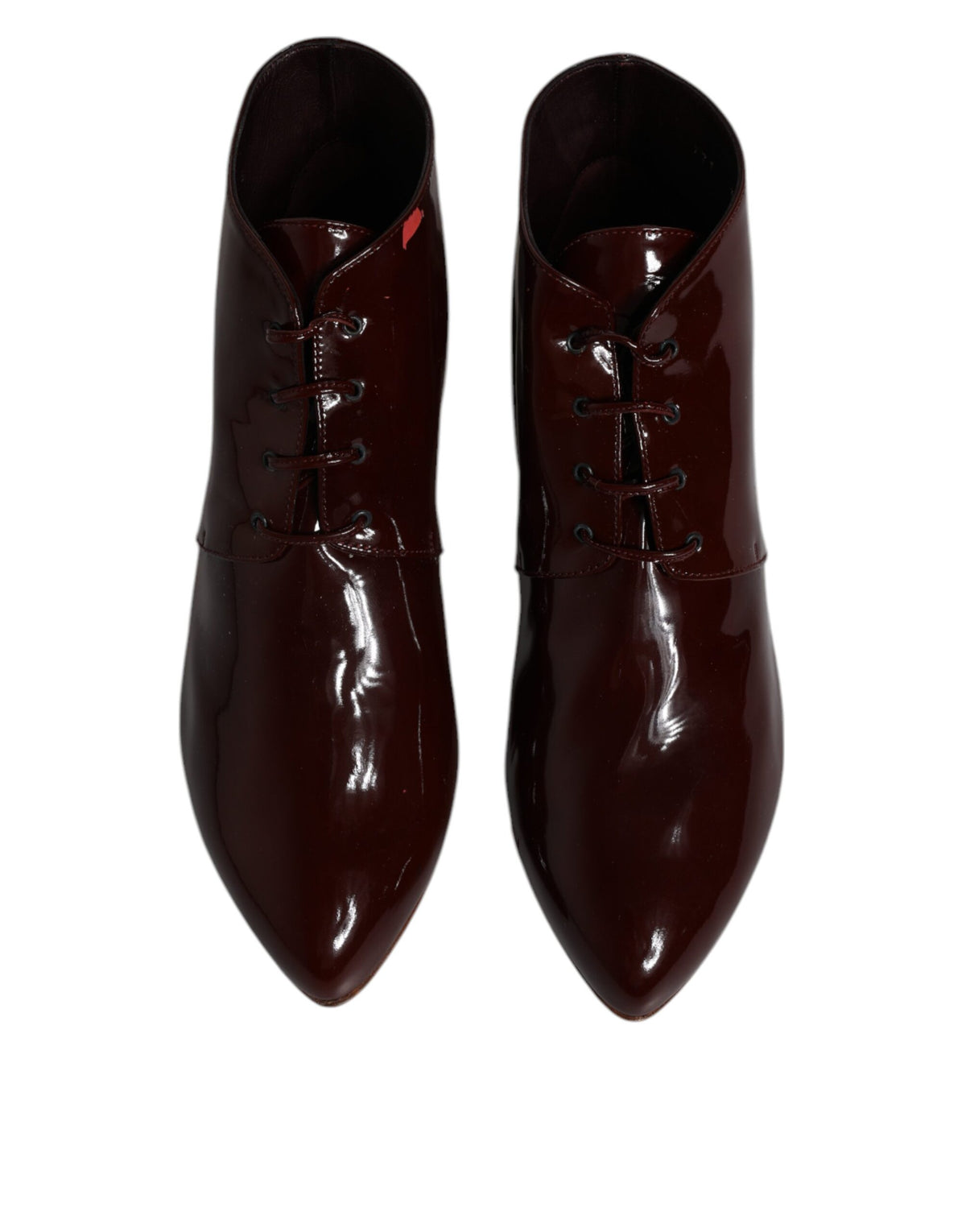 Indulge in the exquisite Dolce & Gabbana Maroon Leather Lace Up Ankle Boots, where Italian craftsmanship meets timeless elegance, perfect for the discerning individual.