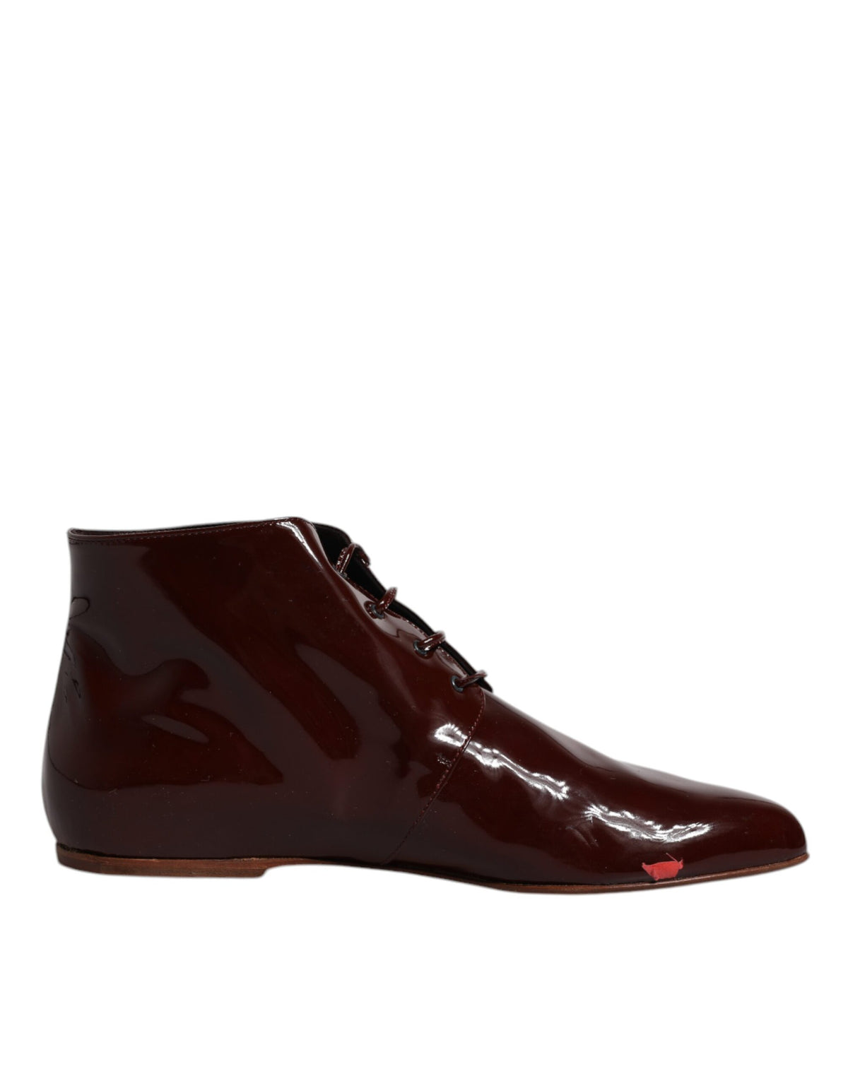 Step into the realm of luxury with Dolce & Gabbana's Maroon Leather Lace Up Ankle Boots, where exquisite craftsmanship meets timeless elegance for the discerning individual.