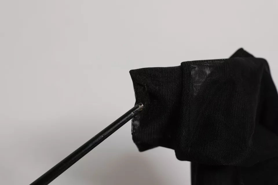 Elevate your style with Dolce & Gabbana's Black Silk Mesh Sock Style Boots, a luxurious blend of silk and nylon, crafted in Italy for the discerning connoisseur.