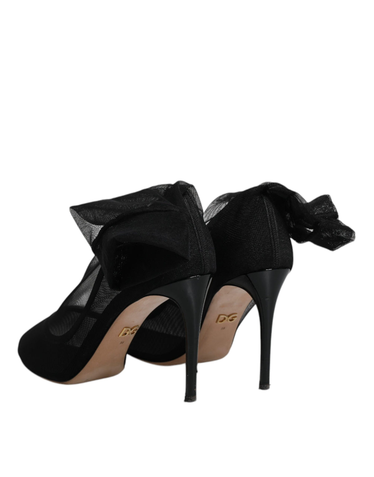 Indulge in the exquisite allure of Dolce & Gabbana's Black Nylon Mesh Sock Style Boots, where luxurious craftsmanship meets timeless elegance, redefining your style narrative.