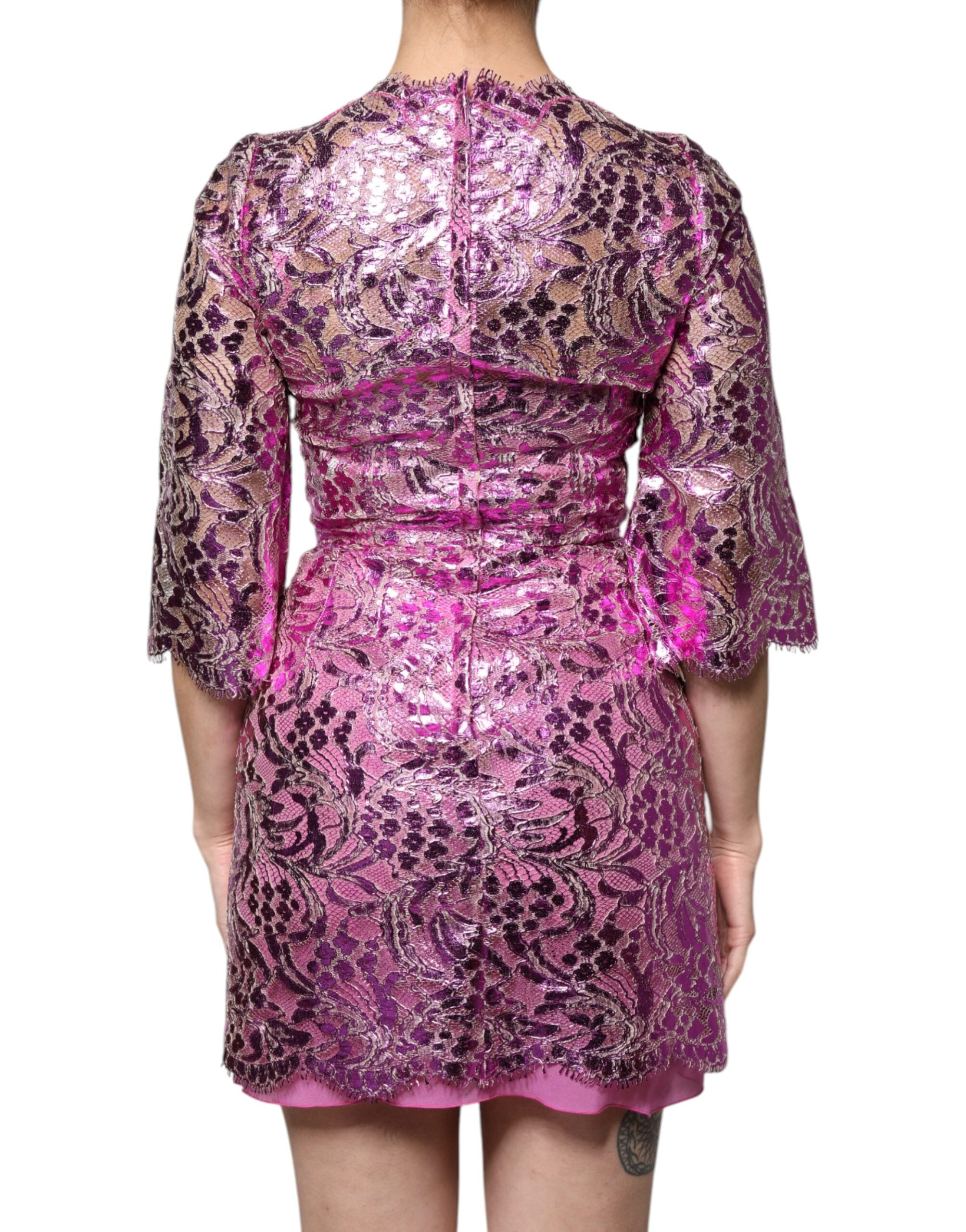 Elevate your wardrobe with the Dolce & Gabbana Metallic Fuchsia Floral Sheath Mini Dress, a masterpiece of Italian craftsmanship that embodies luxury and sensuality.