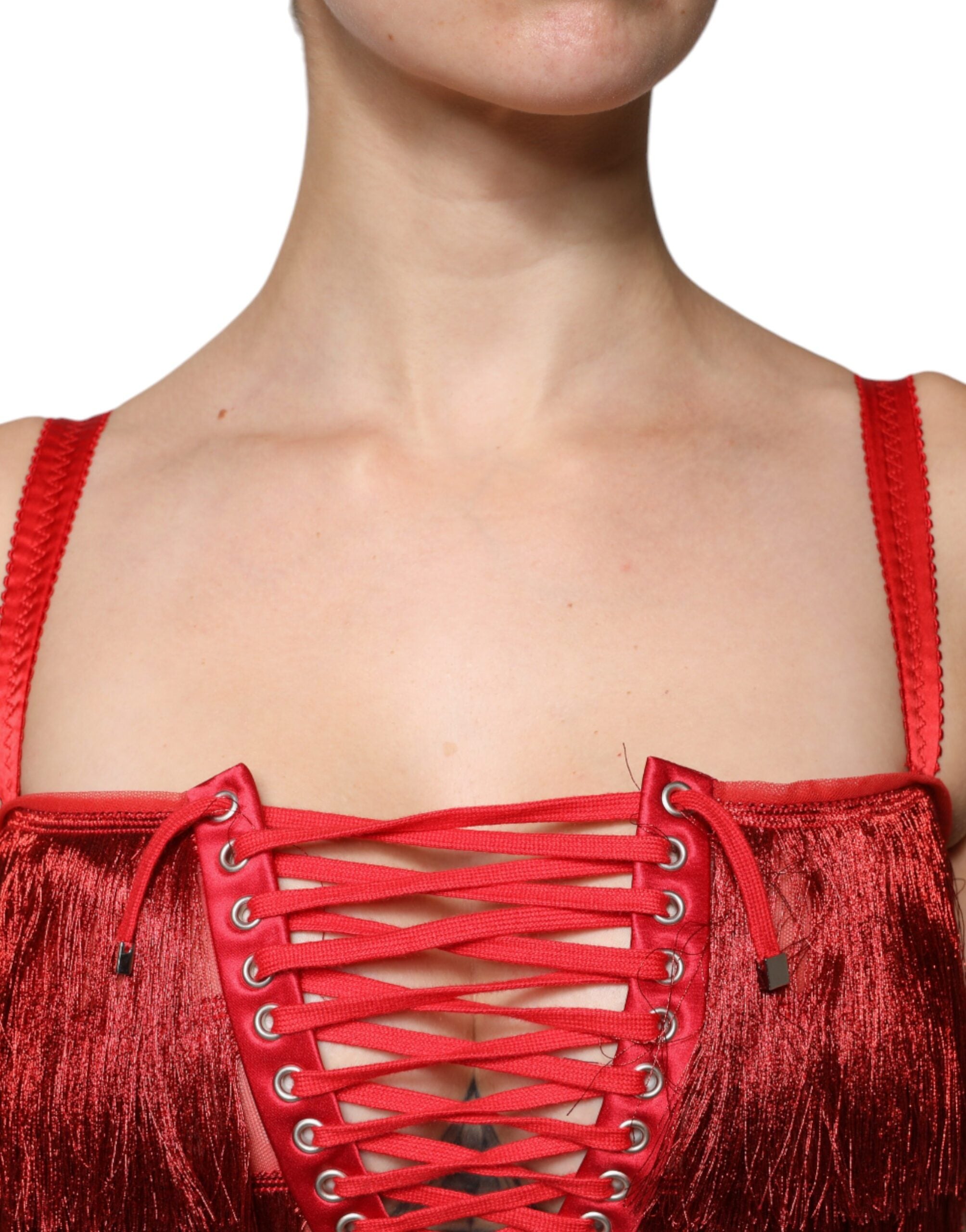 Indulge in the exquisite allure of the Dolce & Gabbana Red Lace Tassel Sleeveless Sheath Mini Dress, where luxurious materials and Italian craftsmanship redefine elegance for the discerning individual.