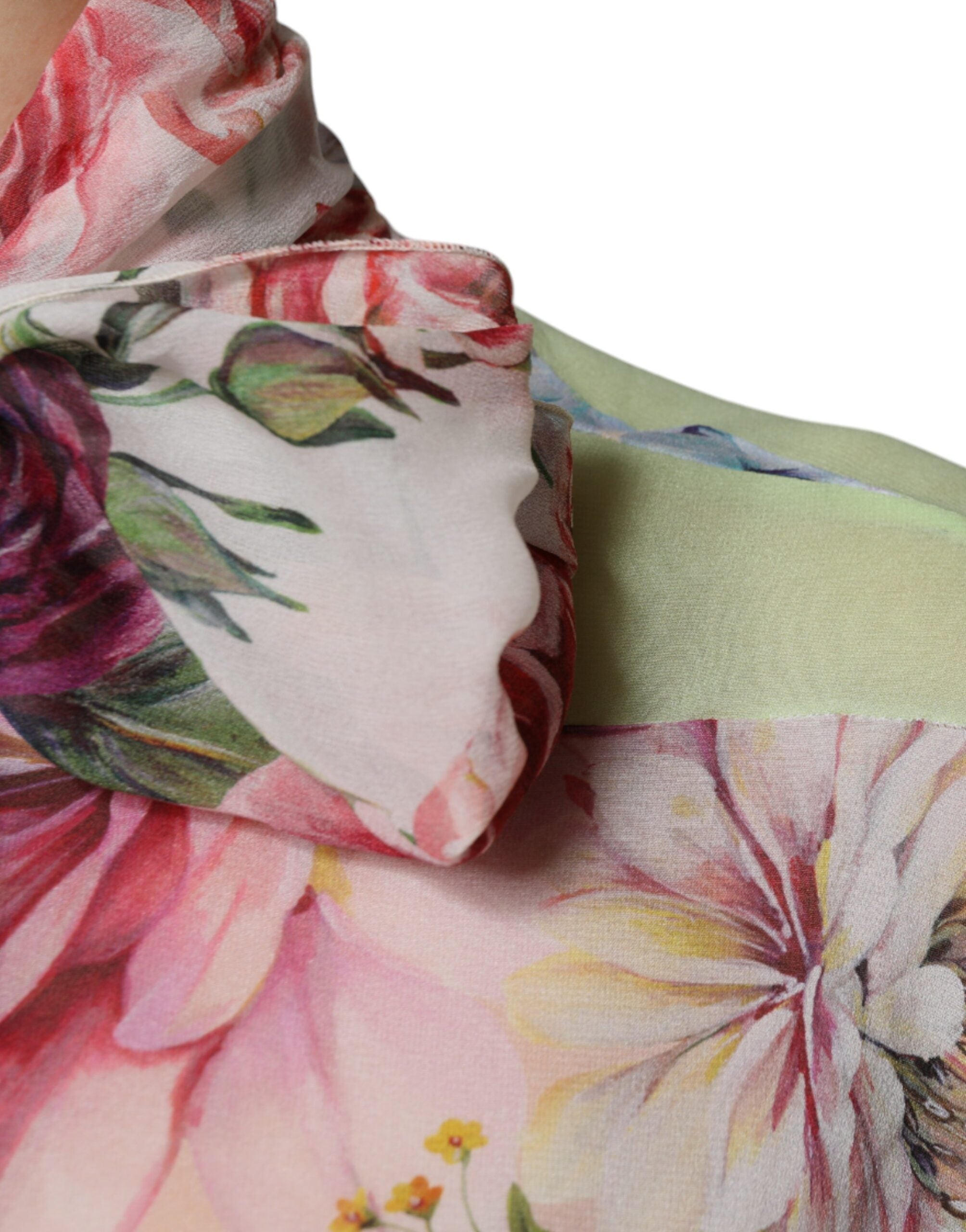 Discover the Dolce & Gabbana Multicolor Floral Patchwork Ascot Collar Top, a silk masterpiece that embodies timeless elegance and luxurious craftsmanship for the discerning individual.