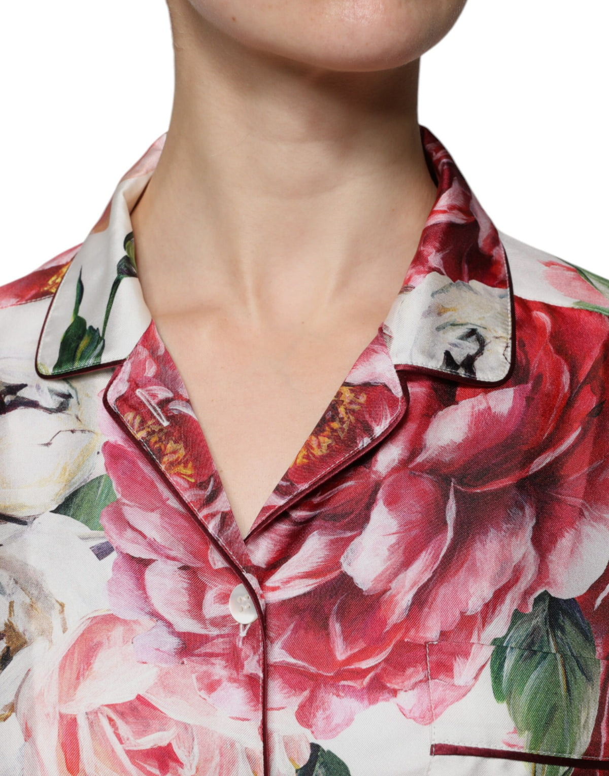 Experience the exquisite allure of Dolce & Gabbana's White Peony Silk Long Sleeves Collared Blouse, a timeless masterpiece embodying Italian craftsmanship and luxurious elegance.