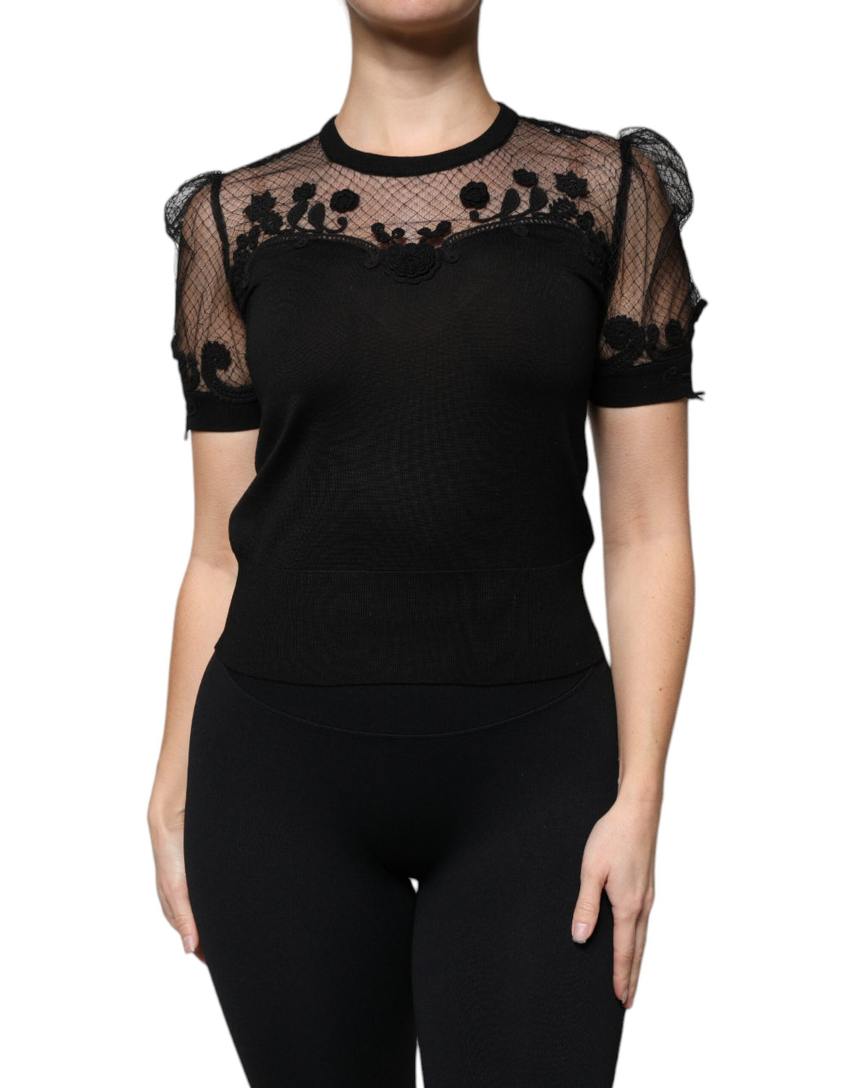 Indulge in the exquisite Dolce & Gabbana Black Floral Lace Short Sleeves Blouse, a masterpiece of silk craftsmanship that embodies timeless elegance and allure.