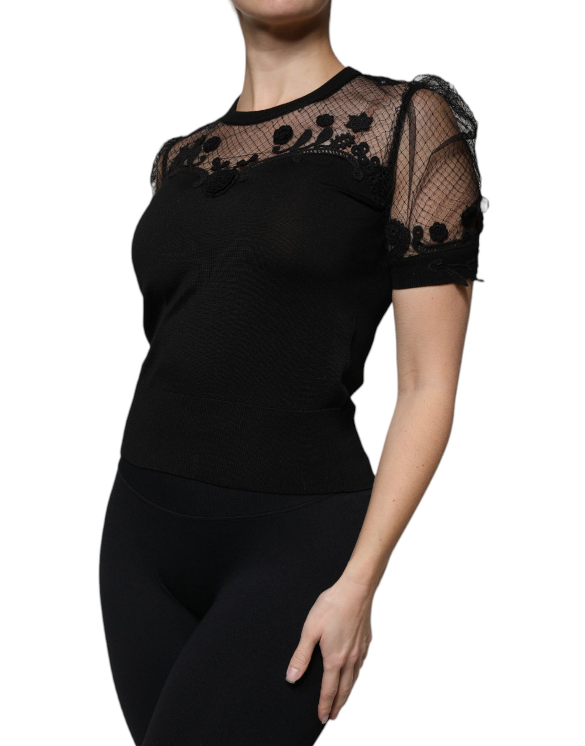 Indulge in the exquisite Dolce & Gabbana Black Floral Lace Blouse, a luxurious silk blend masterpiece that embodies Italian craftsmanship and timeless elegance.