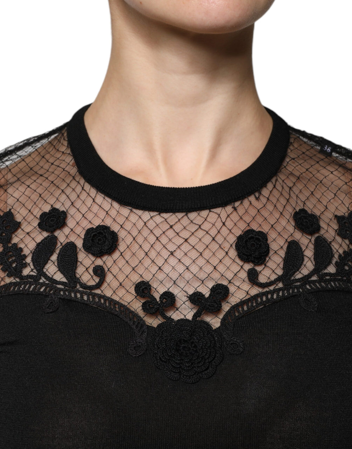 Indulge in the exquisite Dolce & Gabbana Black Floral Lace Short Sleeves Blouse, a masterpiece of silk and lace that embodies timeless elegance and Italian craftsmanship.