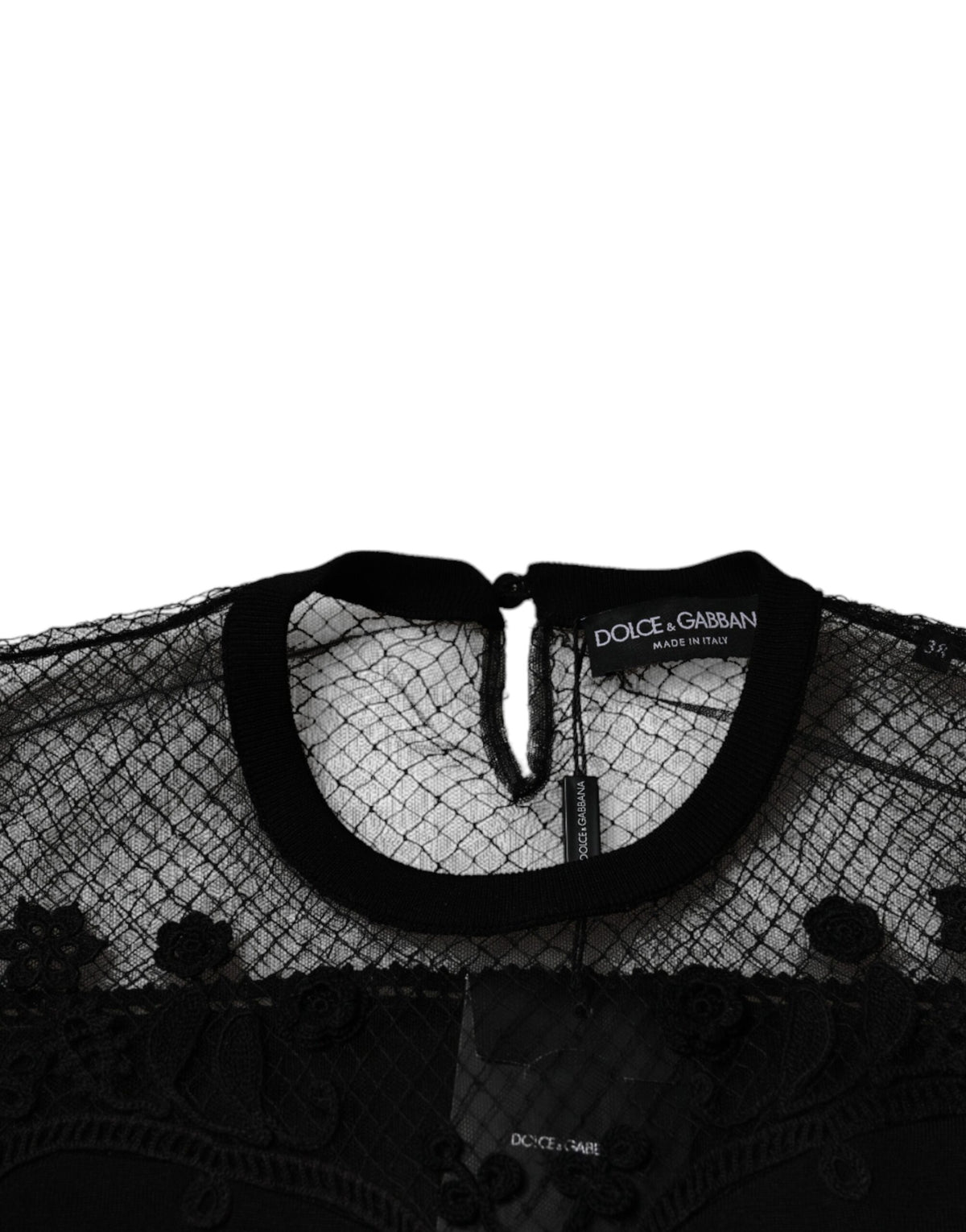 Indulge in the exquisite Dolce & Gabbana Black Floral Lace Blouse, a masterpiece of silk and lace that embodies luxury and sophistication for the discerning individual.