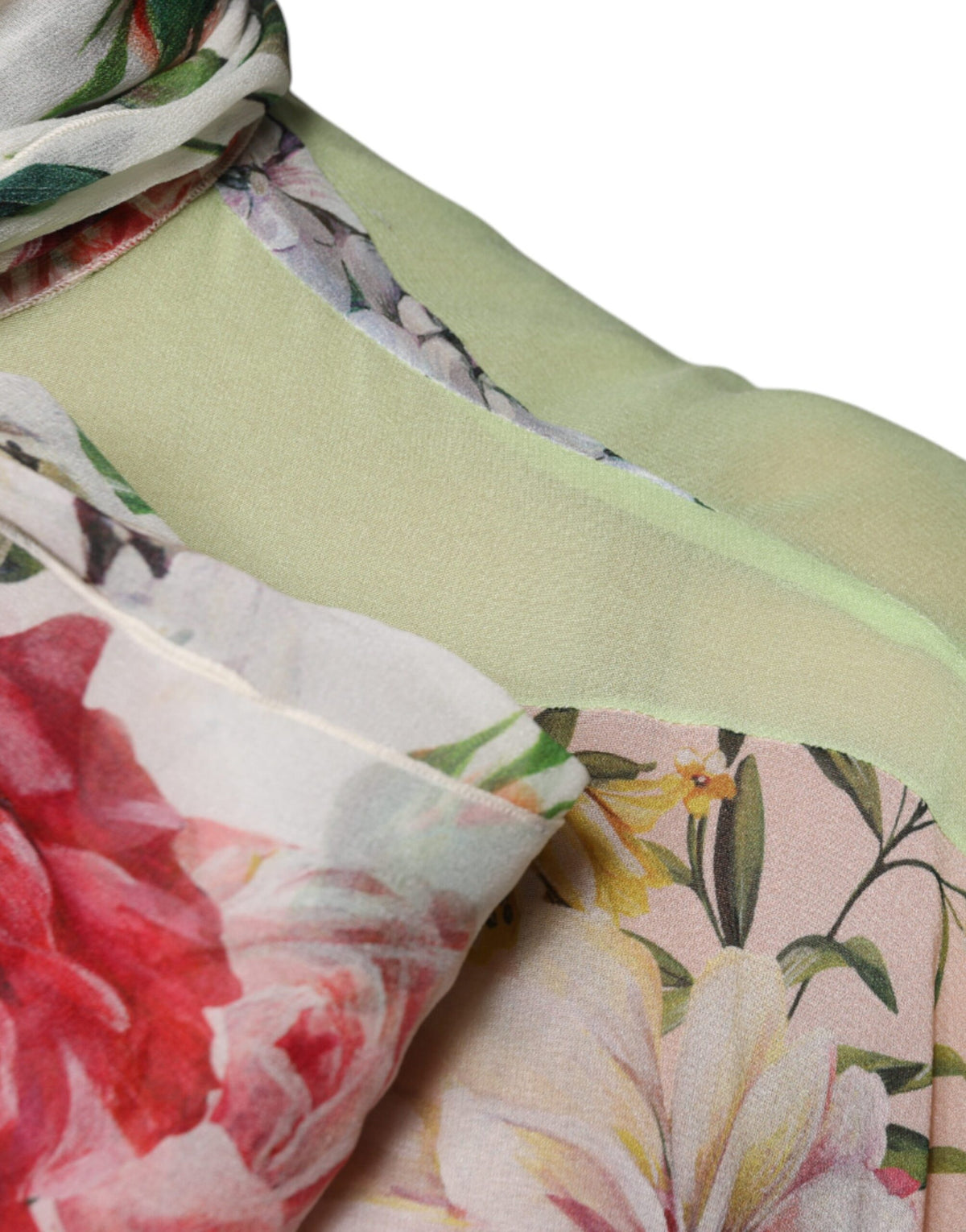 Discover the exquisite Dolce & Gabbana Multicolor Floral Patchwork Ascot Collar Top, a luxurious blend of silk and elastane, embodying timeless elegance and masterful Italian craftsmanship.