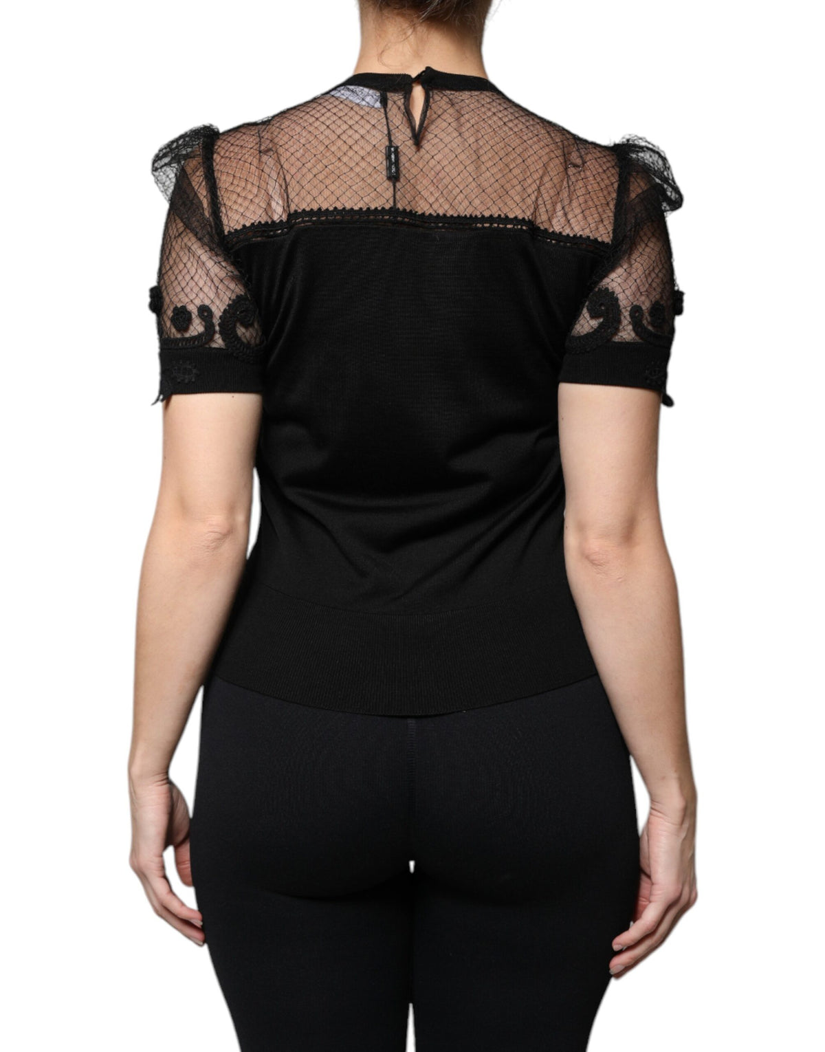 Indulge in the exquisite Dolce & Gabbana Black Floral Lace Short Sleeves Blouse Top, a masterpiece of silk and lace that embodies timeless elegance and sophisticated allure.