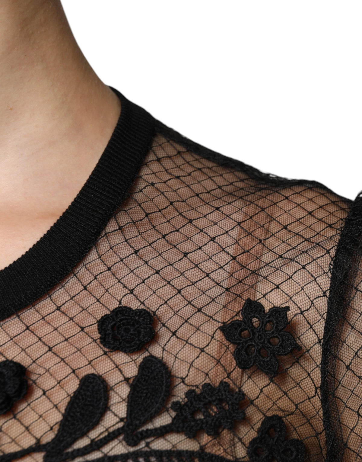 Indulge in the exquisite Dolce & Gabbana Black Floral Lace Short Sleeves Blouse Top, a masterpiece of silk and lace that embodies timeless elegance and unparalleled craftsmanship.