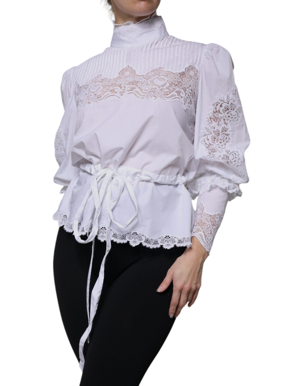 Elevate your wardrobe with the Dolce & Gabbana White Cotton Lace Trim Turtleneck Blouse, a masterpiece of Italian craftsmanship that embodies timeless elegance and allure.
