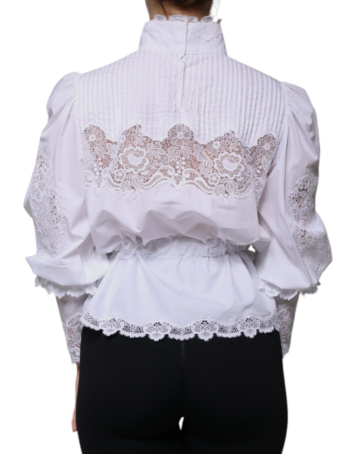 Indulge in the exquisite Dolce & Gabbana White Cotton Lace Trim Turtleneck Blouse, a testament to Italian craftsmanship that elevates your sophisticated style and allure.