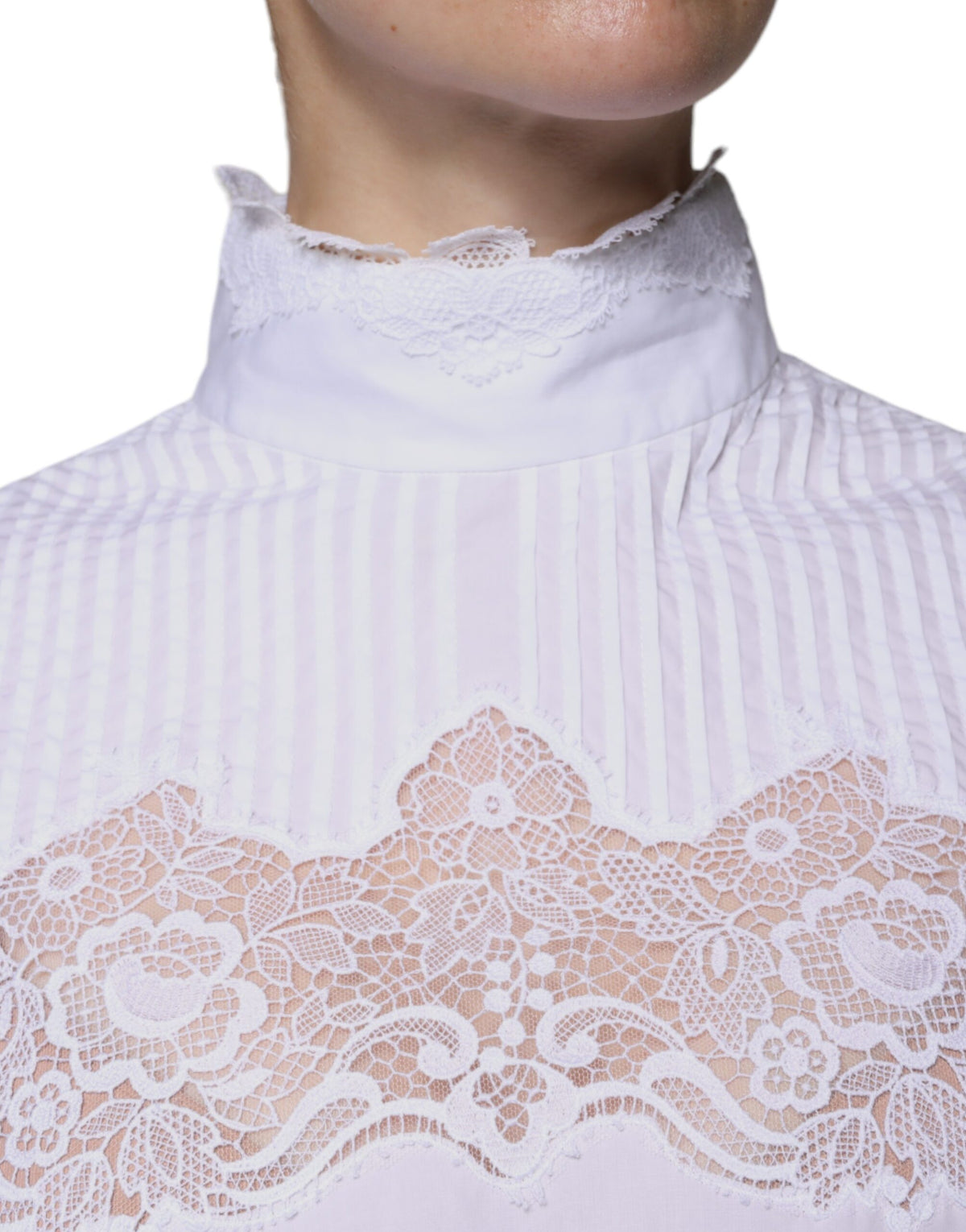 Indulge in the exquisite Dolce & Gabbana White Cotton Lace Trim Turtleneck Blouse, a masterpiece of Italian craftsmanship that elevates your sophisticated allure.
