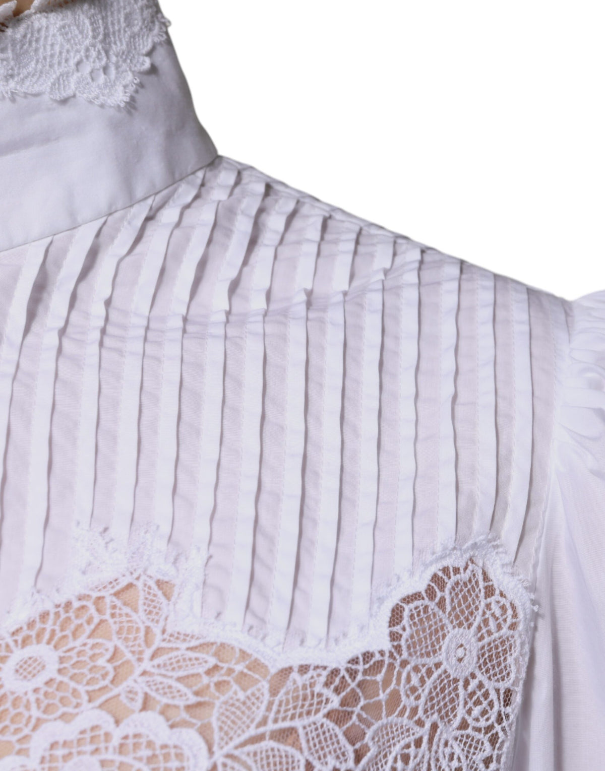 Elevate your wardrobe with the Dolce & Gabbana White Cotton Lace Trim Turtleneck Blouse, a masterpiece of Italian craftsmanship that embodies timeless elegance and sensual allure.