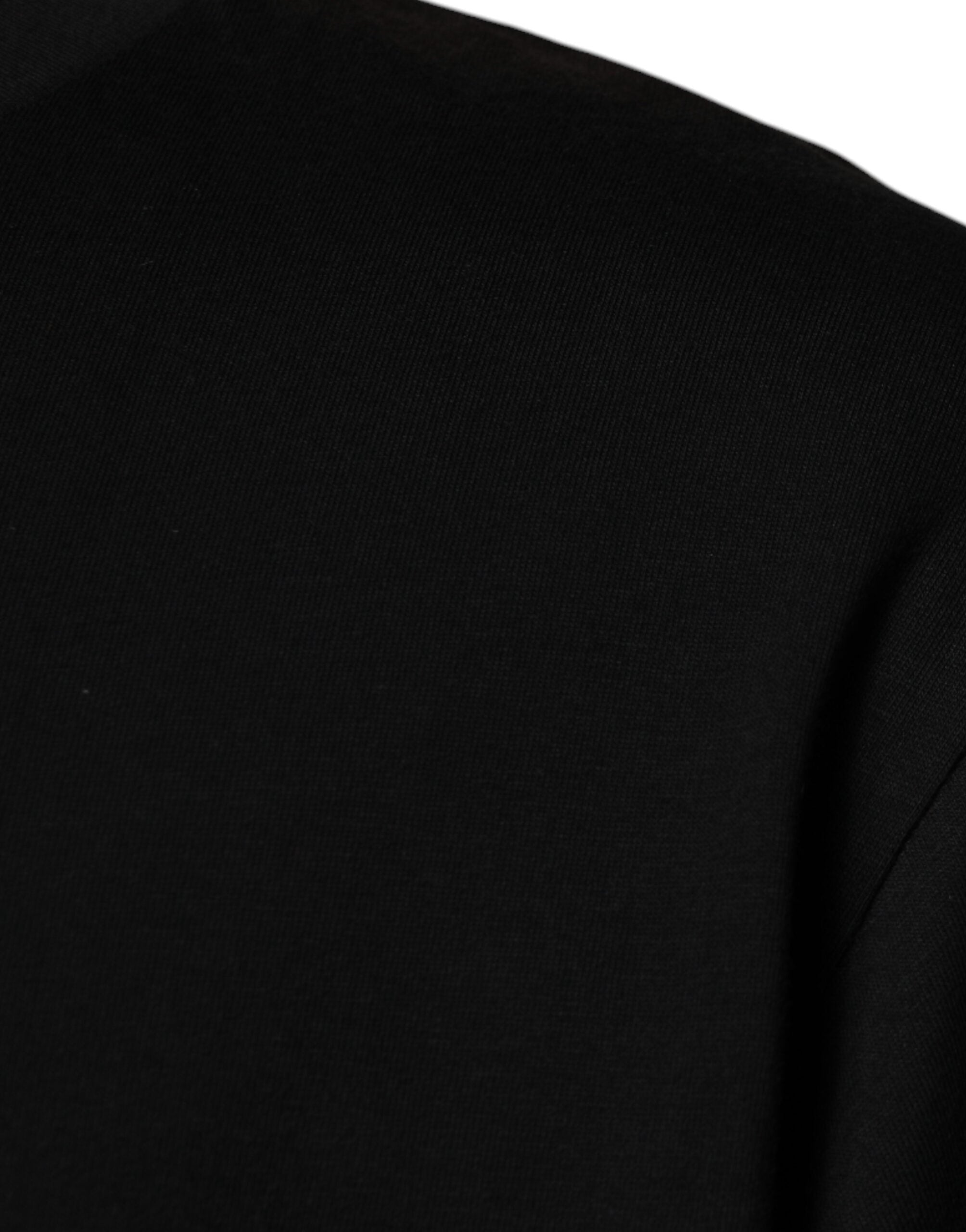Indulge in the exquisite Dolce & Gabbana Black Crew Neck Short Sleeve T-shirt, a luxurious blend of 100% cotton craftsmanship that elevates your style with timeless elegance.