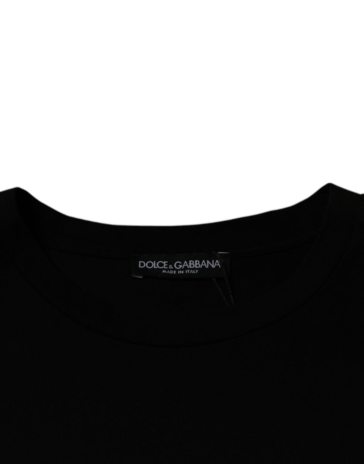 Experience the allure of the Dolce & Gabbana Black Crew Neck Short Sleeve T-shirt, crafted from luxurious 100% cotton, a timeless staple that embodies elegance and sophistication.