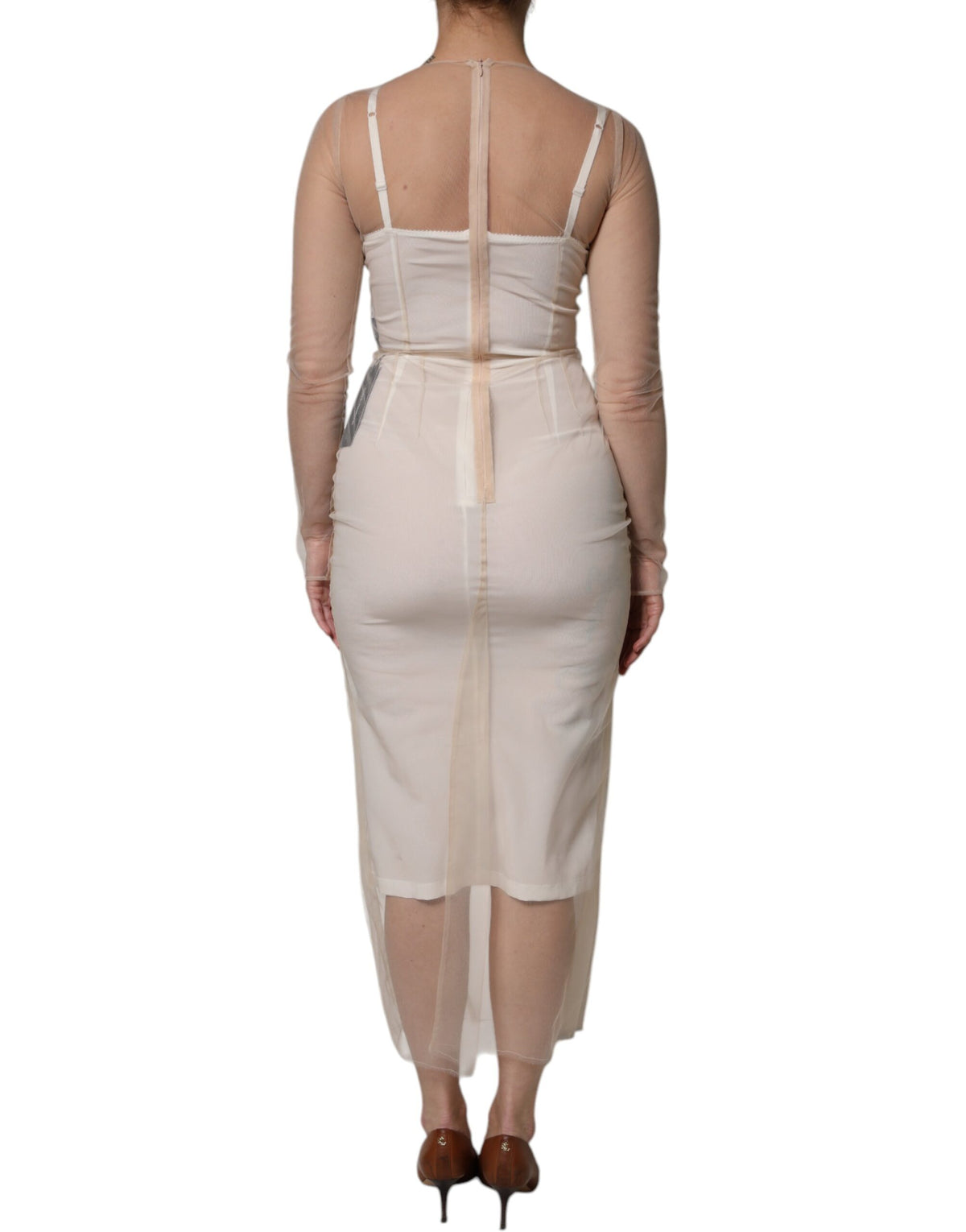Experience the allure of the Dolce & Gabbana White Sheer Tulle Bustier Bodycon Midi Dress, a masterpiece of Italian craftsmanship that redefines elegance for every occasion.
