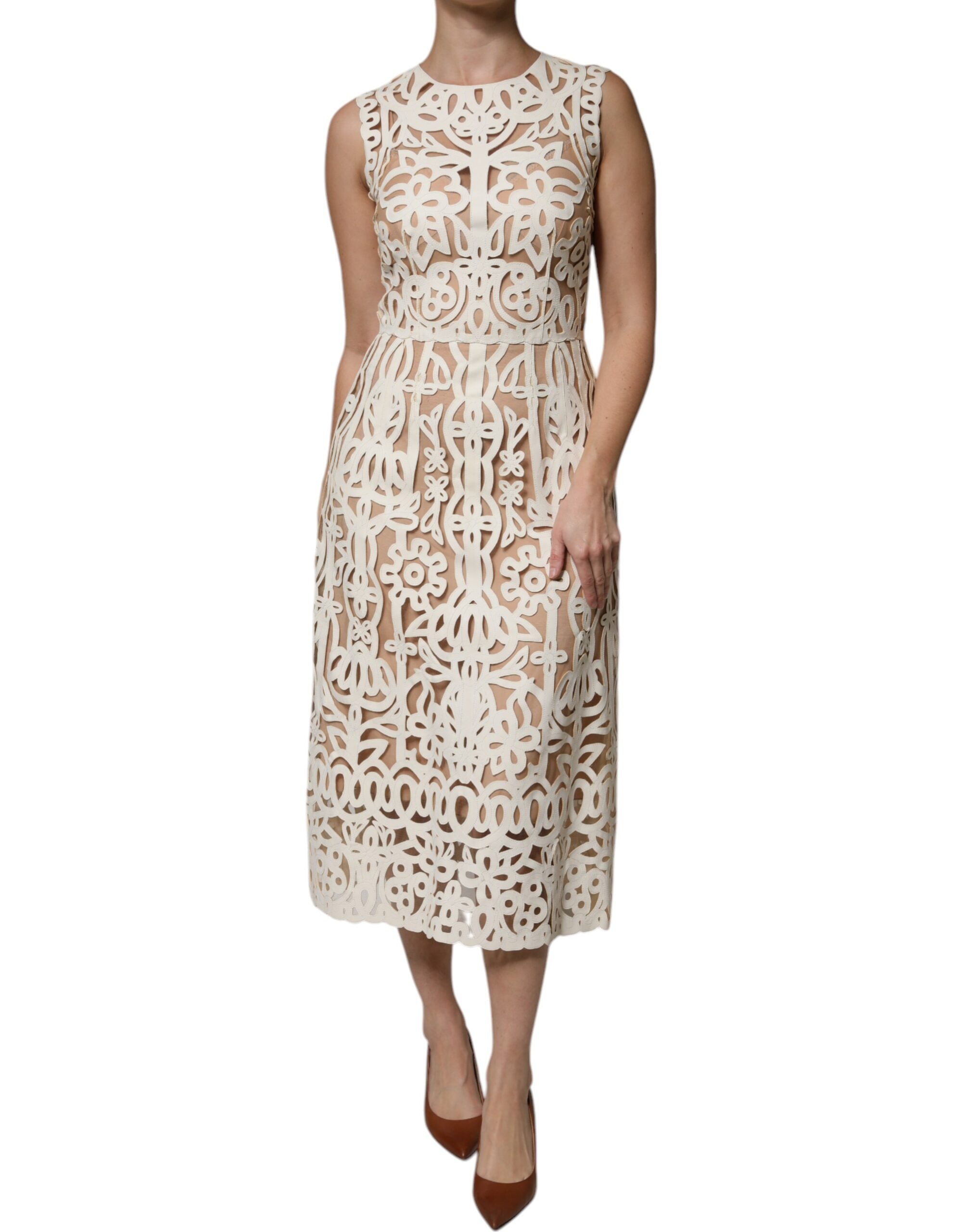 Experience the exquisite allure of the Dolce & Gabbana White Cut Out Leather Sleeveless Midi Dress, a masterpiece of artisanal craftsmanship in luxurious lamb leather, designed for the discerning individual who embodies sophistication and elegance.