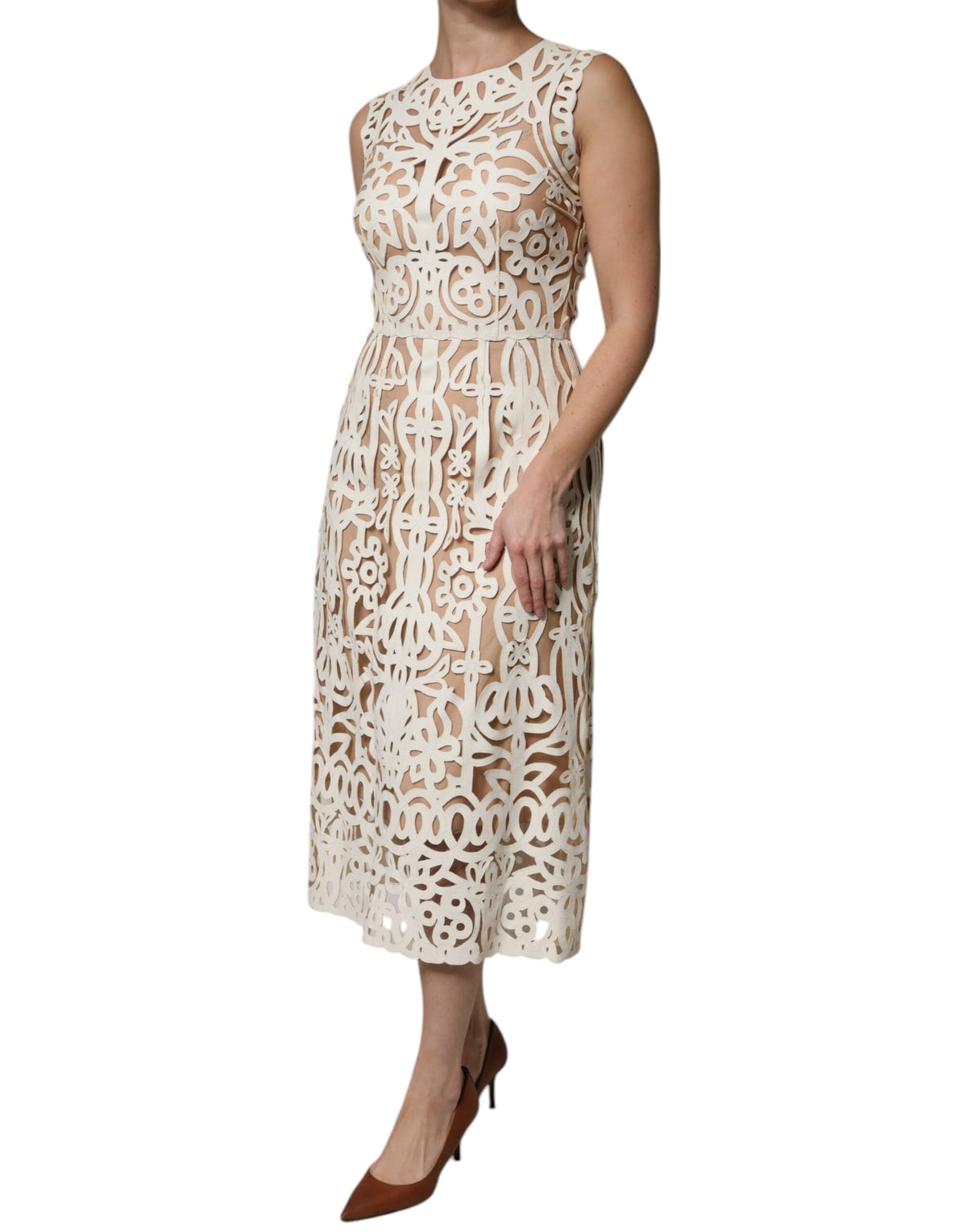 Indulge in the exquisite allure of the Dolce & Gabbana White Cut Out Leather Sleeveless Midi Dress, where luxurious lamb leather meets artisanal craftsmanship for a timeless statement.