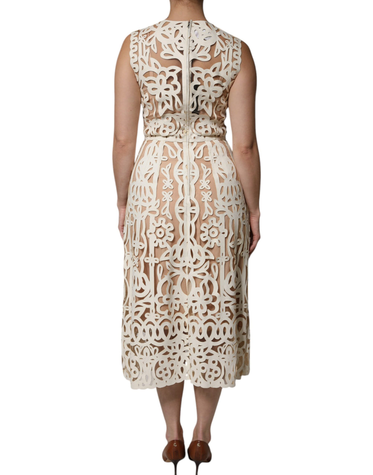 Indulge in the exquisite Dolce & Gabbana White Cut Out Leather Sleeveless Midi Dress, where luxurious lamb leather meets Italian artistry, perfect for the discerning individual.