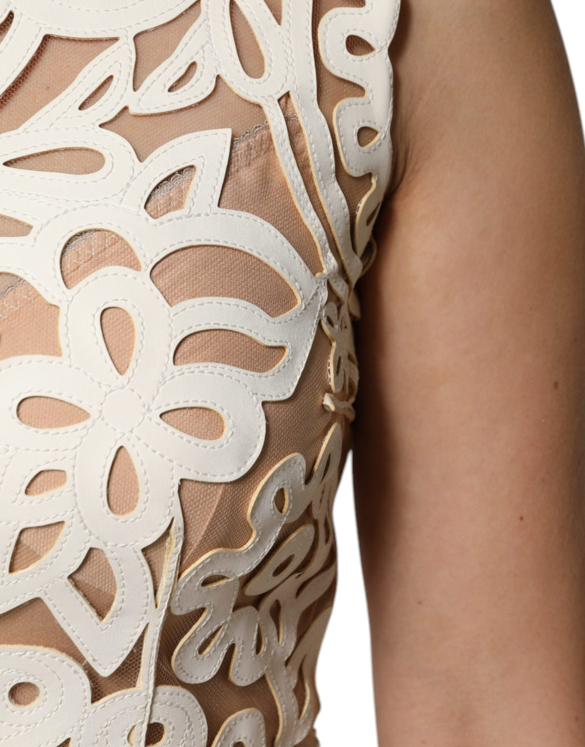 Elevate your wardrobe with the Dolce & Gabbana White Cut Out Leather Sleeveless Midi Dress, a masterpiece of artisanal elegance crafted from luxurious lamb leather and silk.